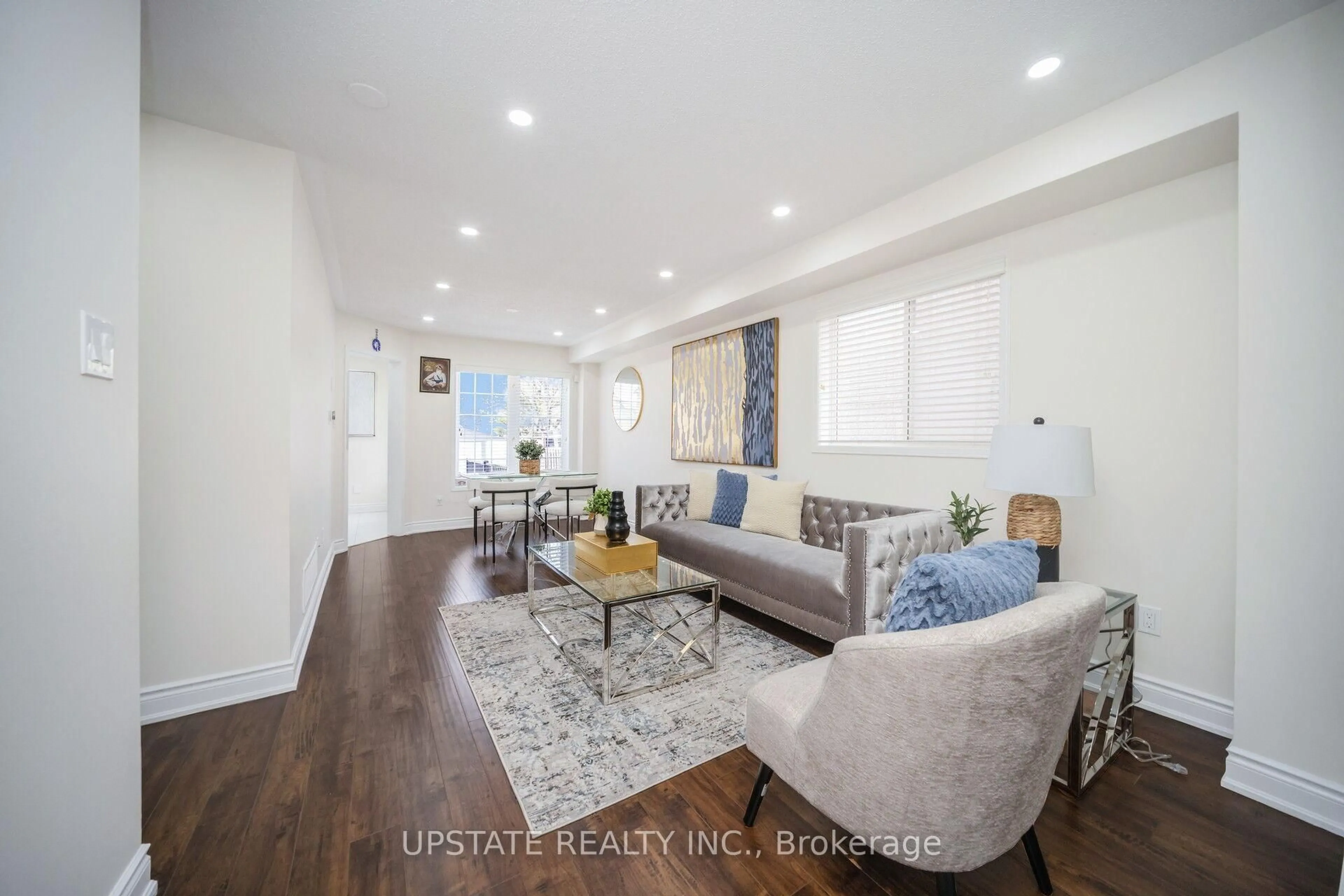 Living room with furniture, wood/laminate floor for 50 Penbridge Circ, Brampton Ontario L7A 2P9