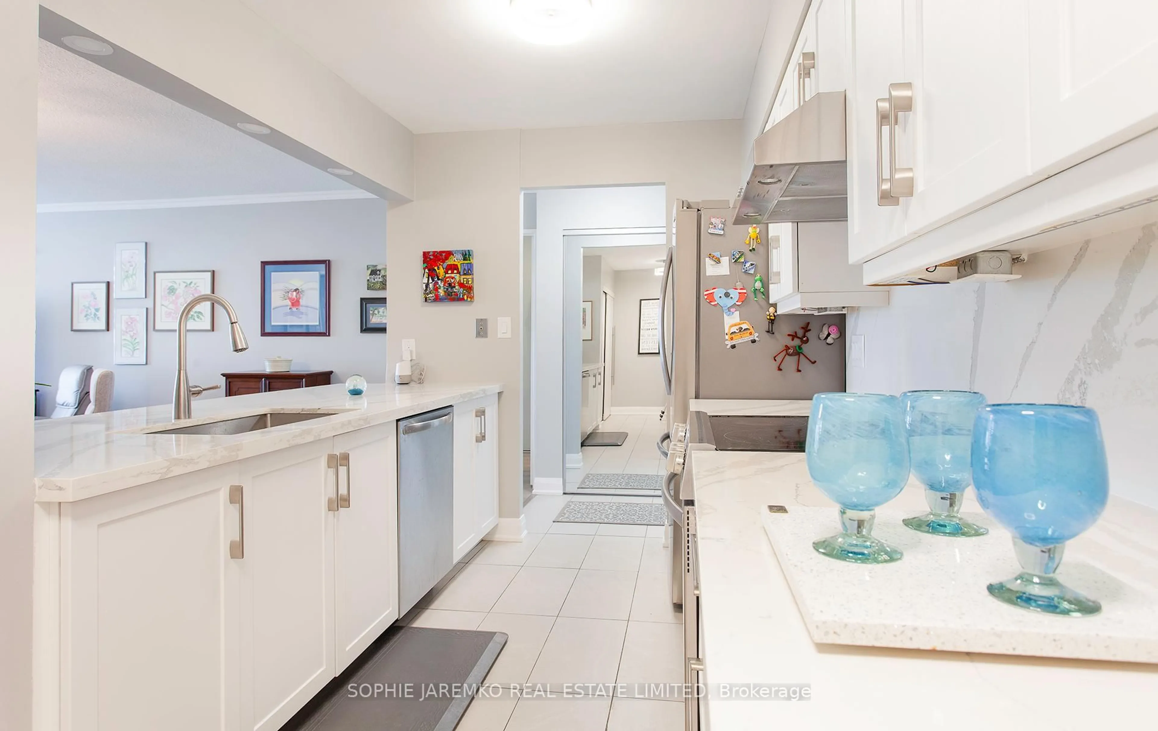 Kitchen with laundary machines, ceramic/tile floor for 22 Southport St #538, Toronto Ontario M6S 4Y9