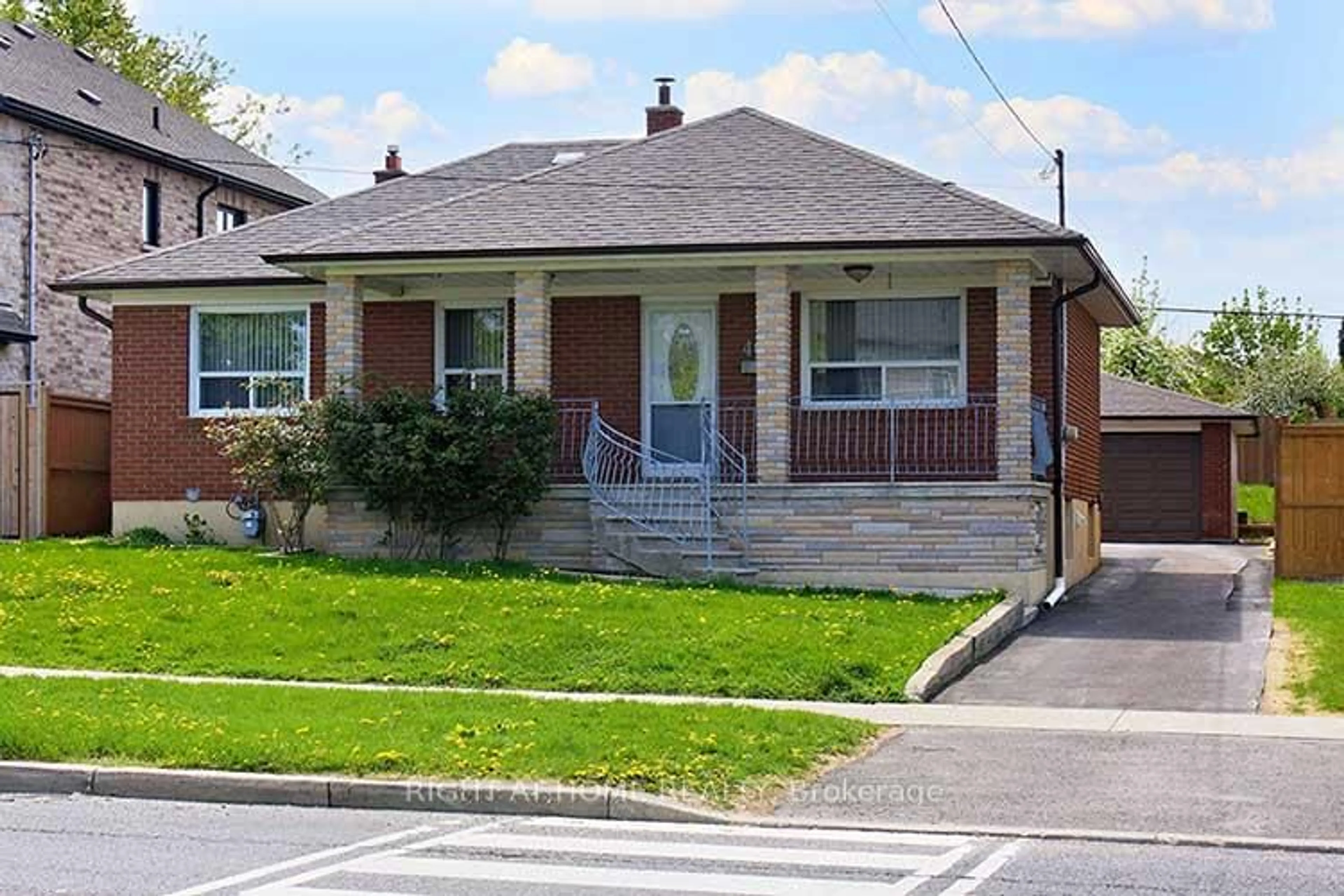 Home with brick exterior material, street for 409 Rustic Rd, Toronto Ontario M6L 1W8