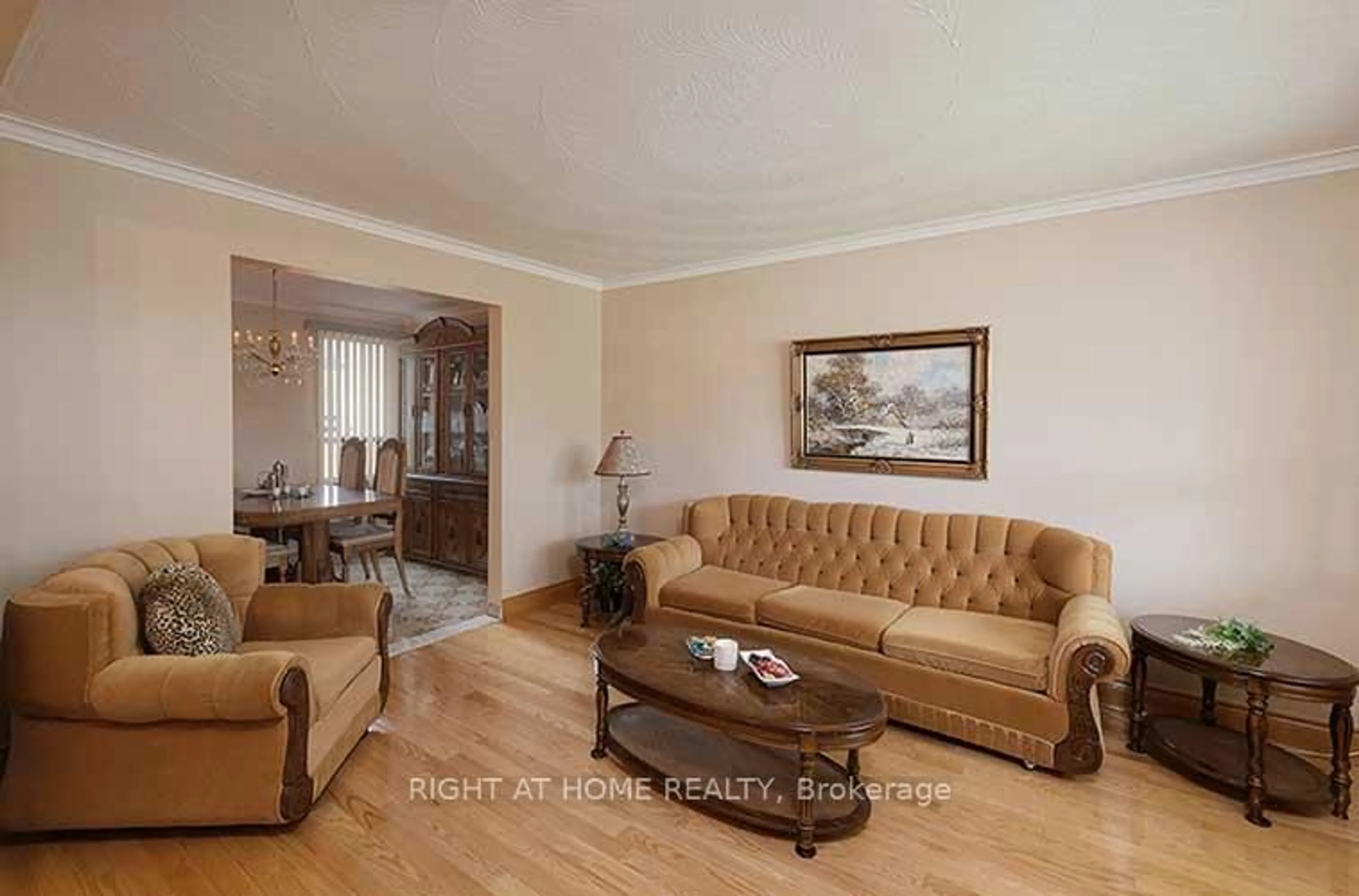 Living room with furniture, wood/laminate floor for 409 Rustic Rd, Toronto Ontario M6L 1W8