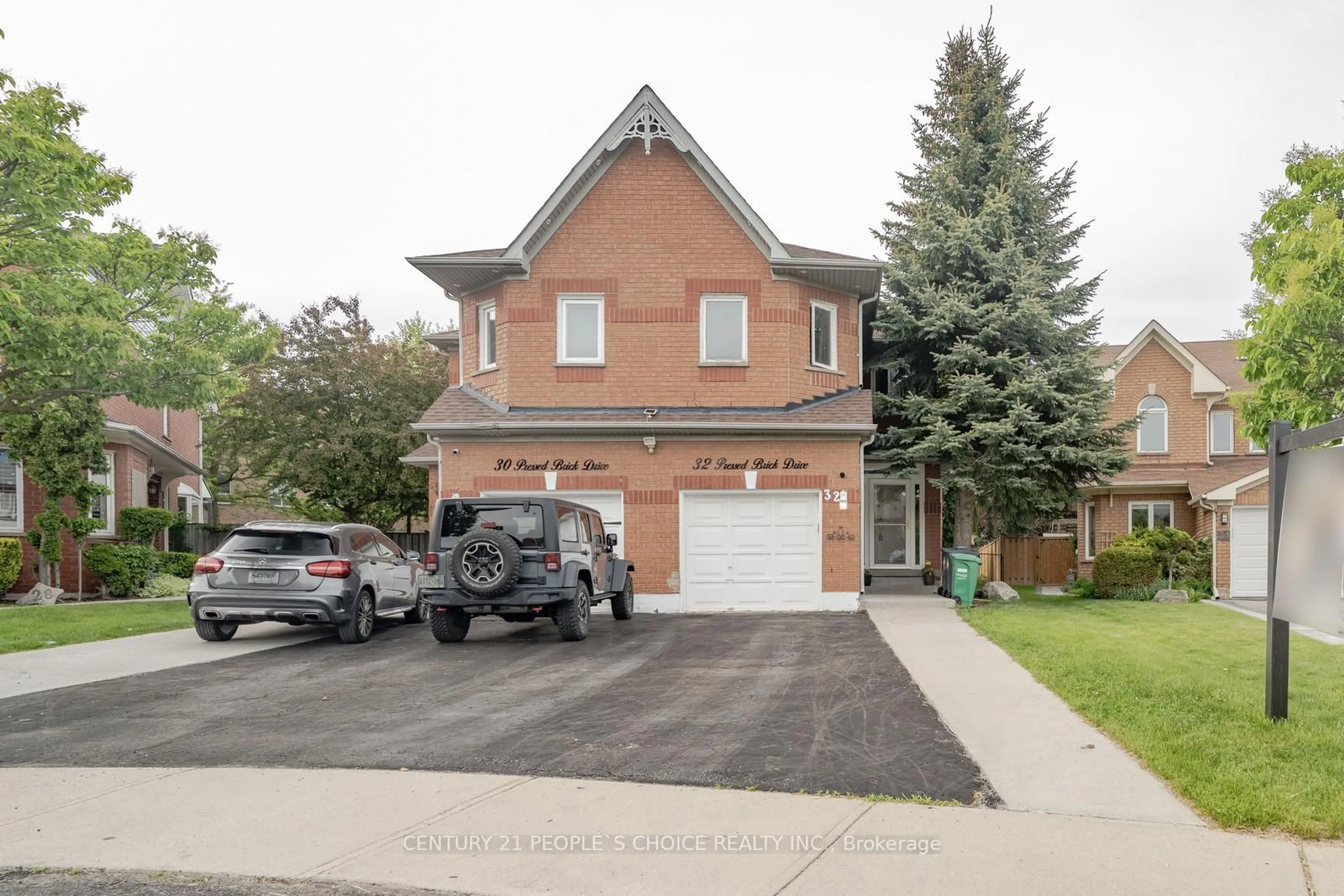 Home with brick exterior material, street for 32 Pressed Brick Dr, Brampton Ontario L6V 4K3