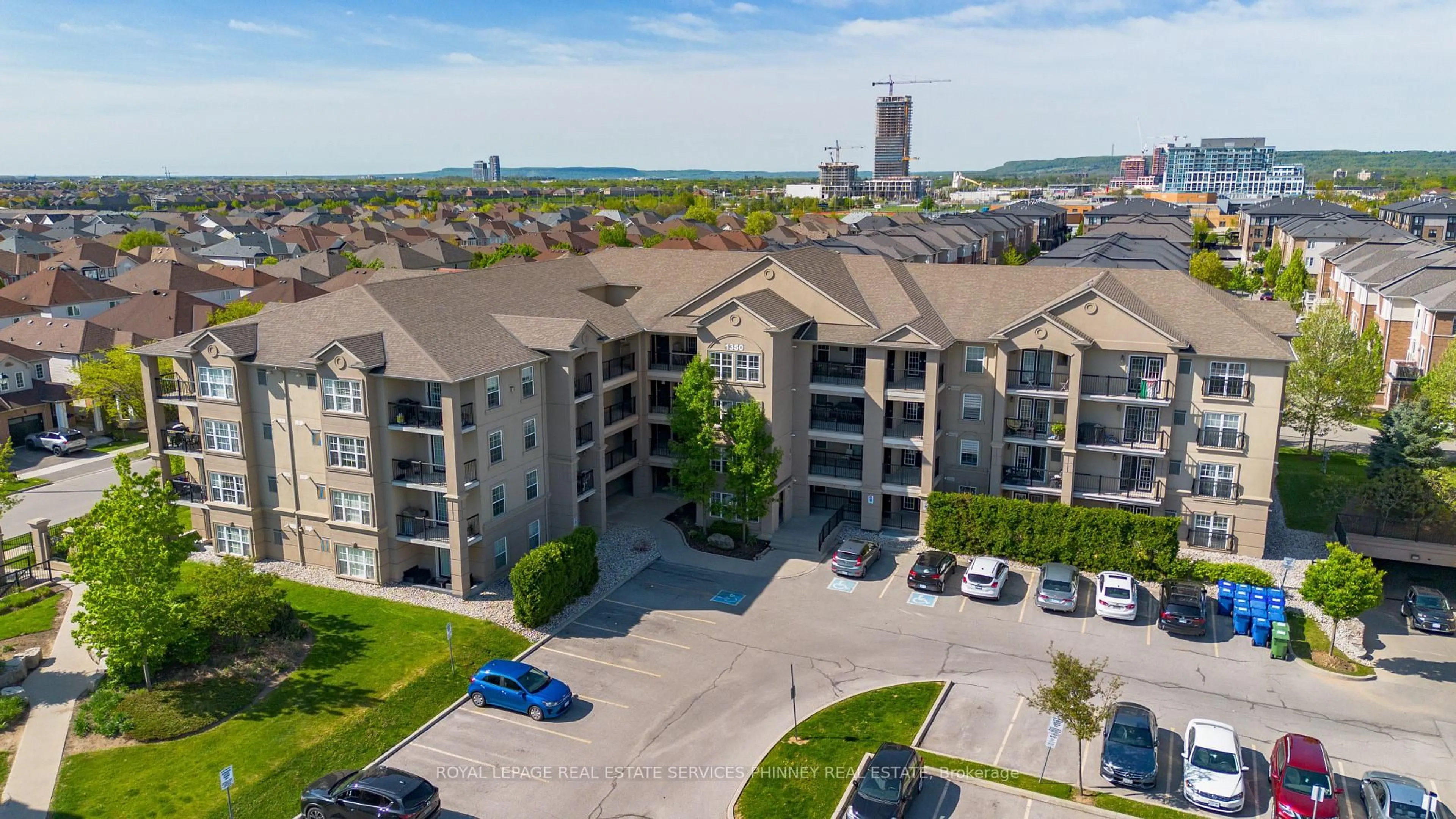 A pic from outside/outdoor area/front of a property/back of a property/a pic from drone, city buildings view from balcony for 1350 Main St #208, Milton Ontario L9T 7S7