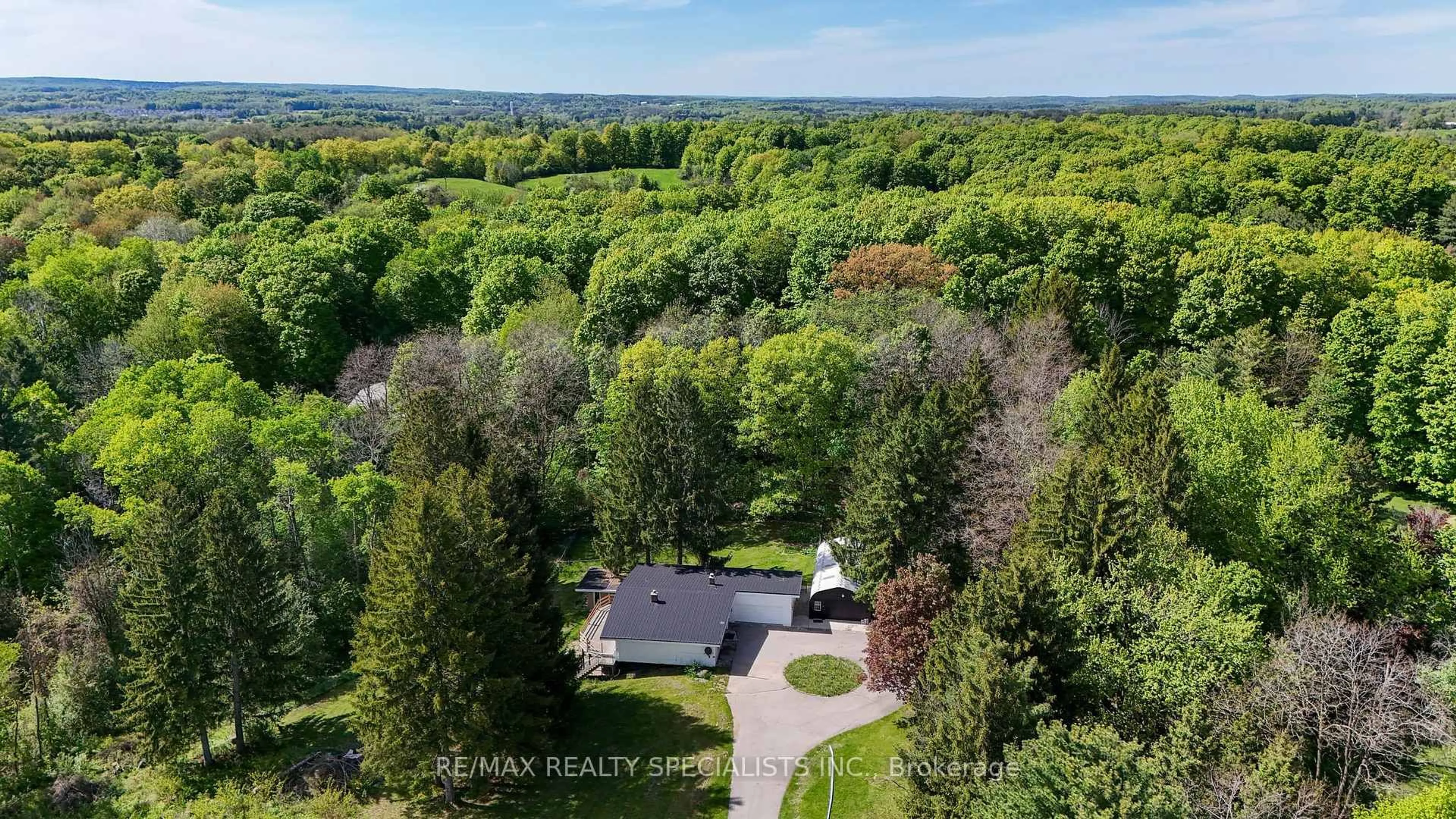 A pic from outside/outdoor area/front of a property/back of a property/a pic from drone, forest/trees view for 7062 Castlederg Sdrd, Caledon Ontario L7C 0P4