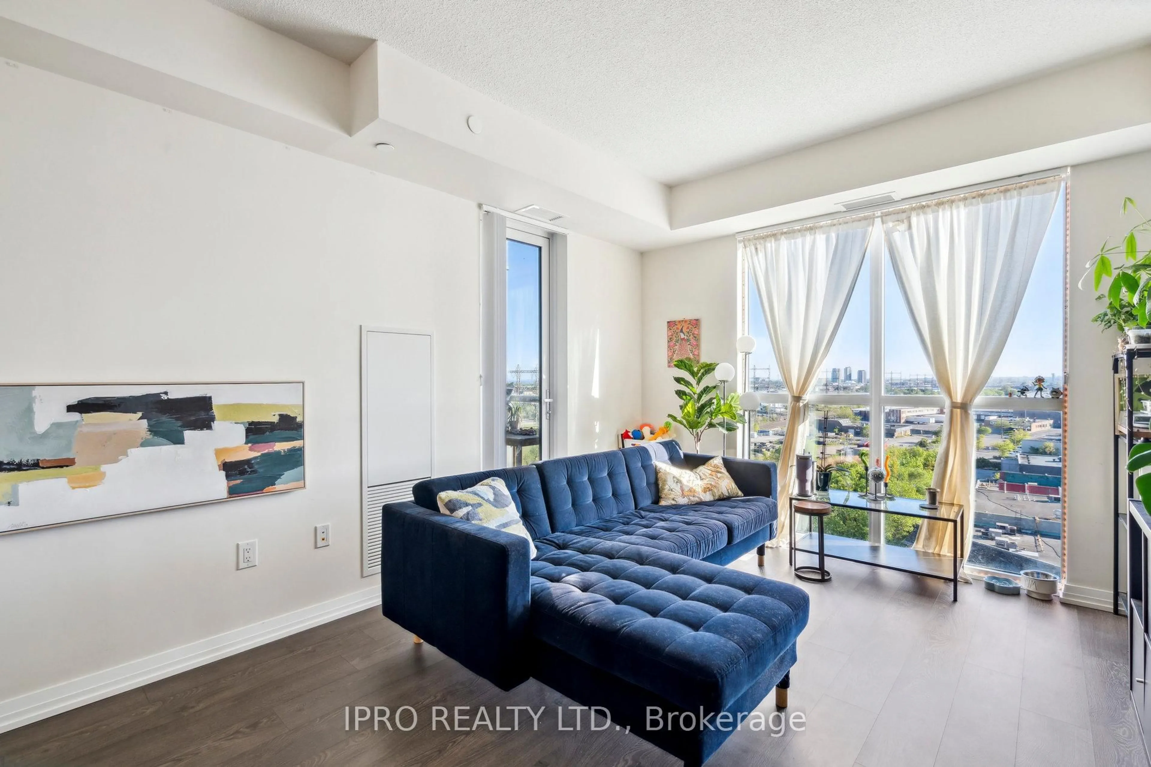 Living room with furniture, unknown for 50 Thomas Riley Rd #706, Toronto Ontario M9B 0C5