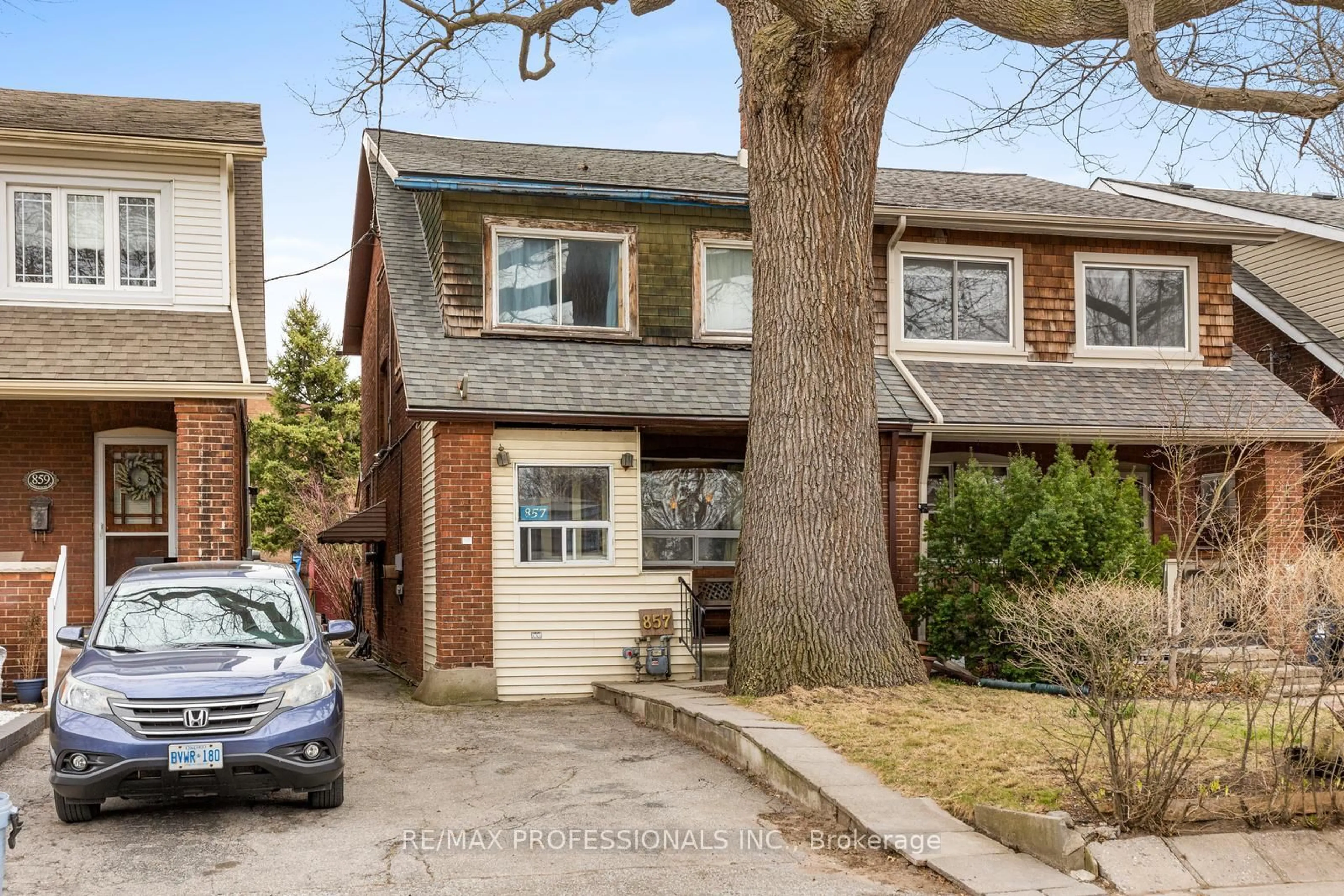 Home with brick exterior material, street for 857 Windermere Ave, Toronto Ontario M6S 3M5