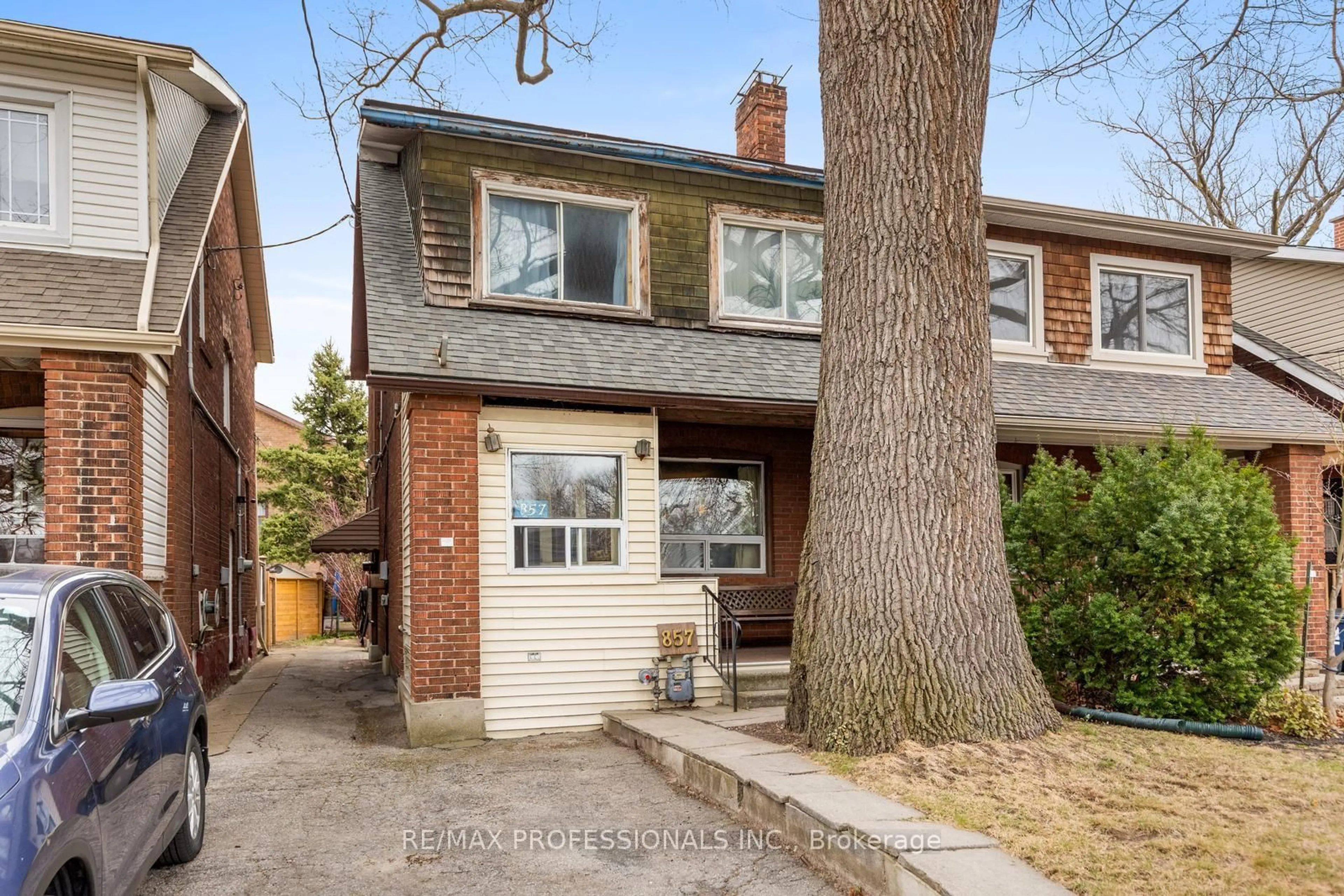 Home with brick exterior material, street for 857 Windermere Ave, Toronto Ontario M6S 3M5