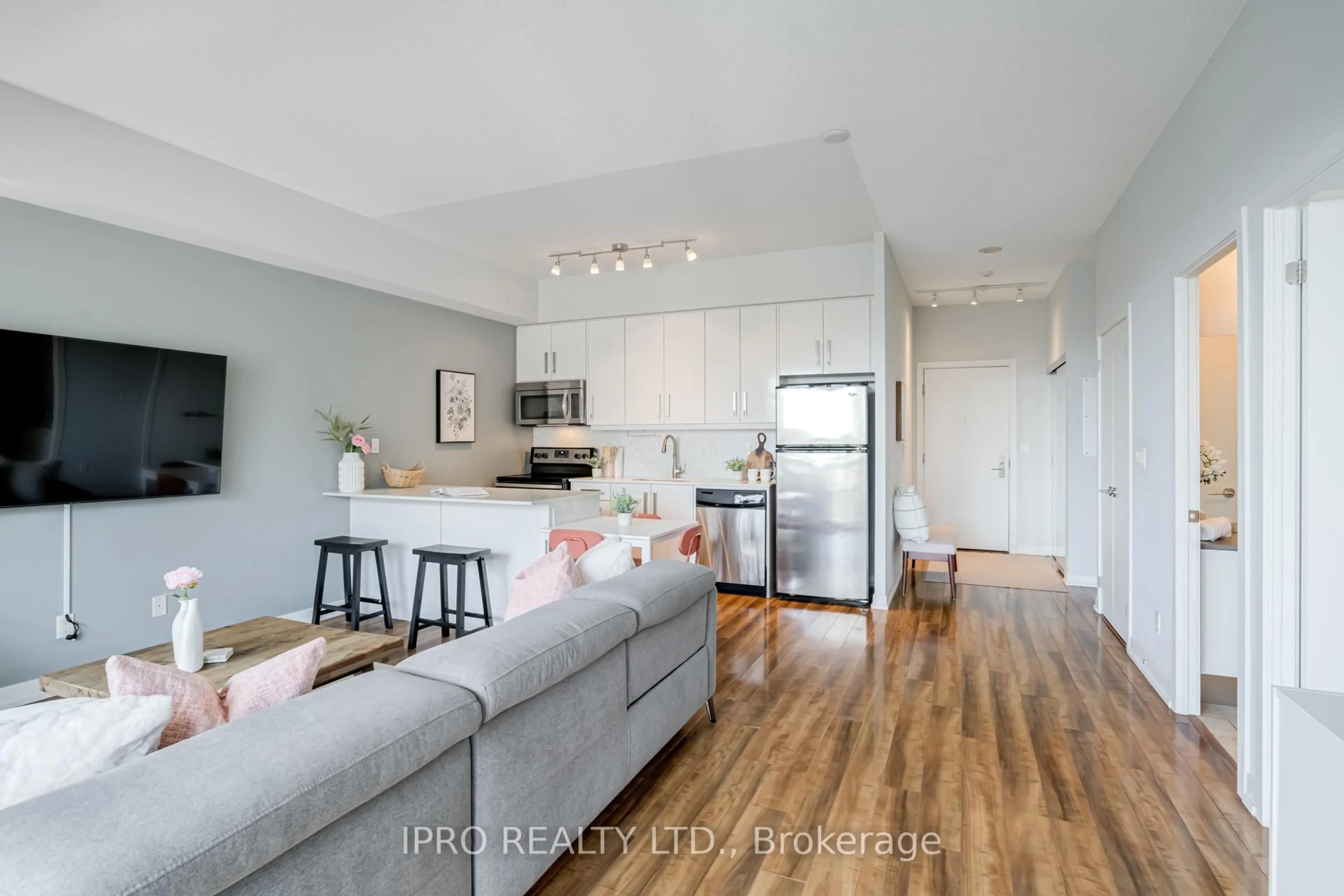 Open concept kitchen, wood/laminate floor for 5101 Dundas St #406, Toronto Ontario M9A 5G8