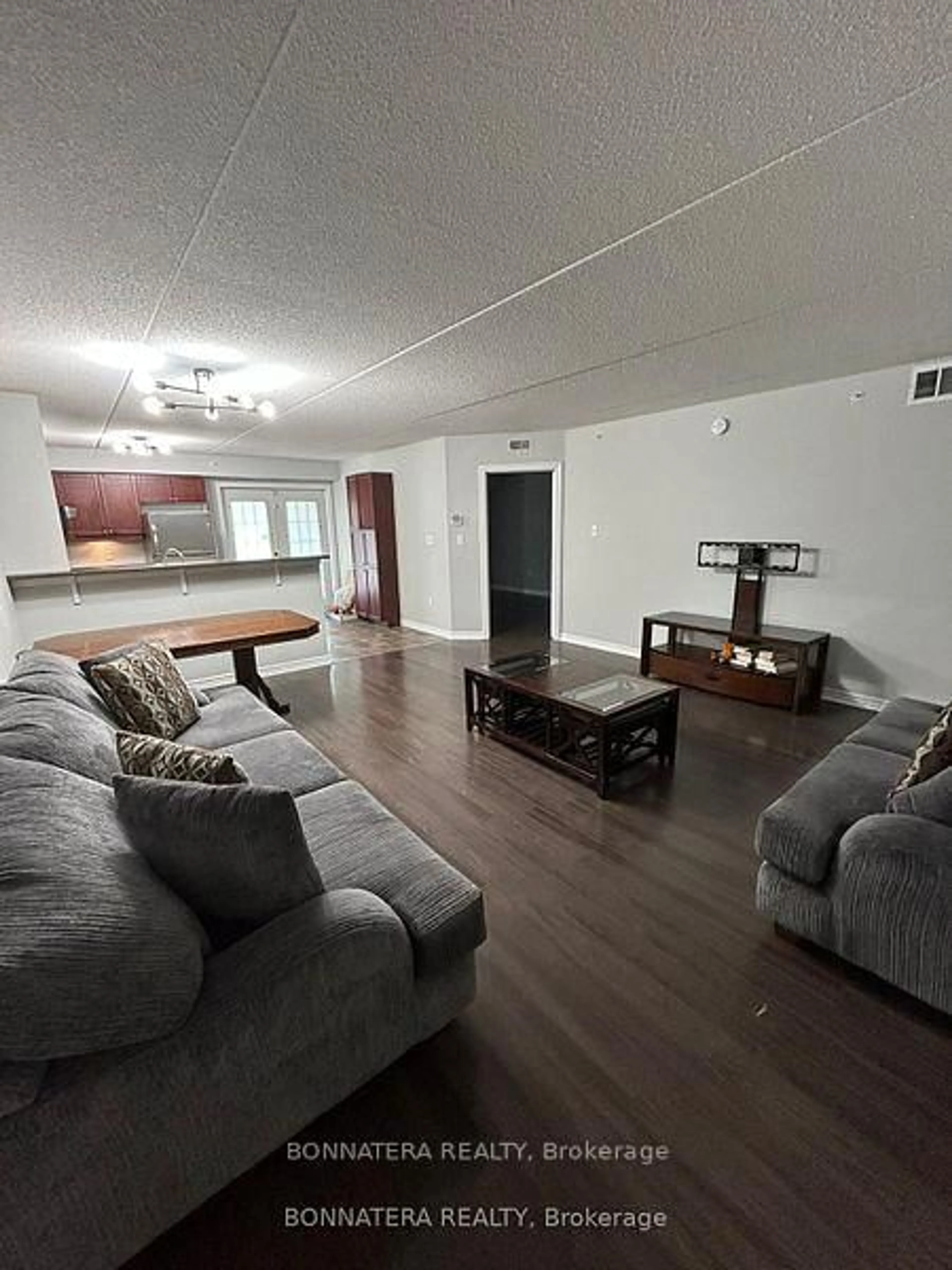 Living room with furniture, unknown for 1350 Main St #112, Milton Ontario L9T 7S7