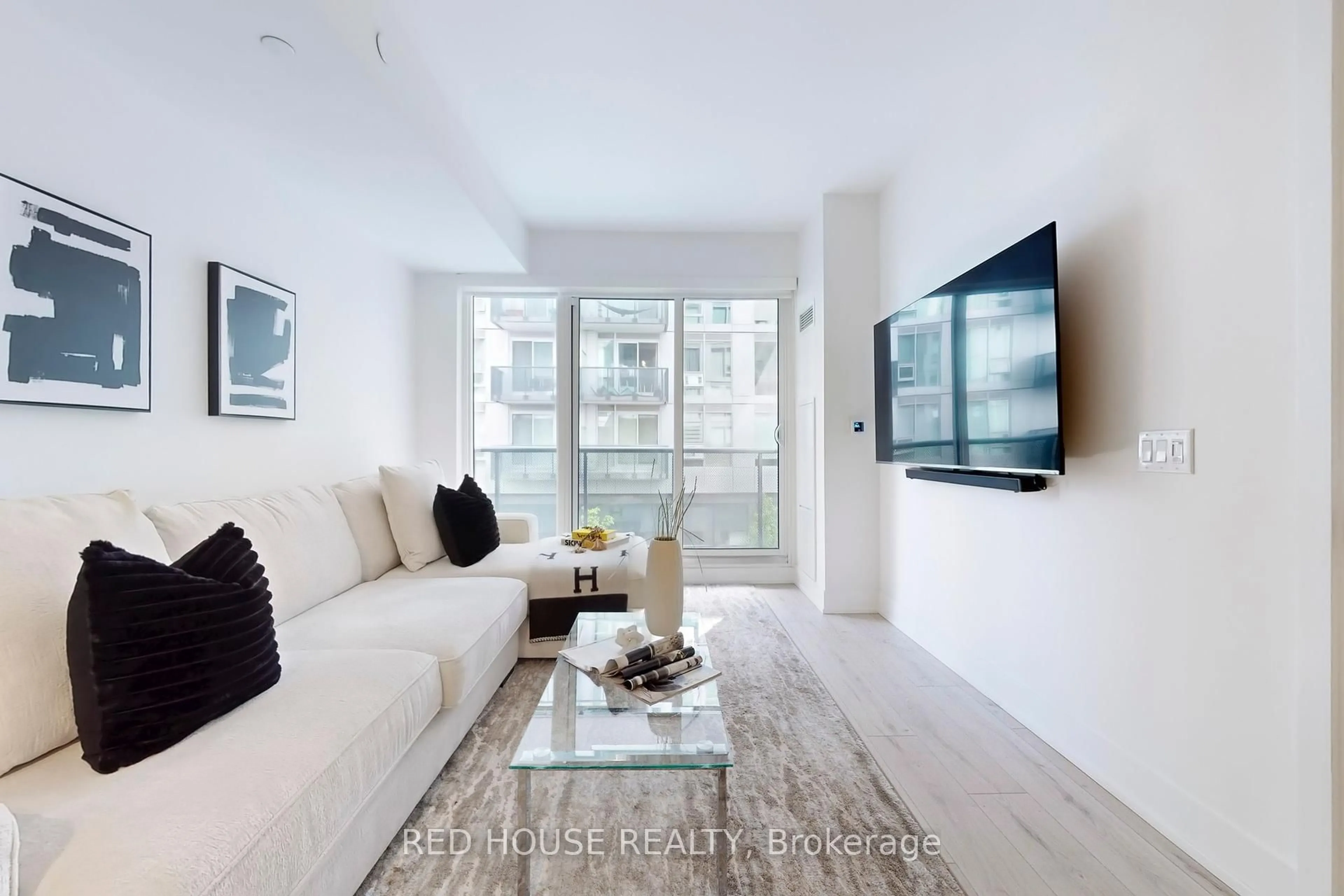 Living room with furniture, unknown for 2450 Old Bronte Rd #219, Oakville Ontario L6M 5P6
