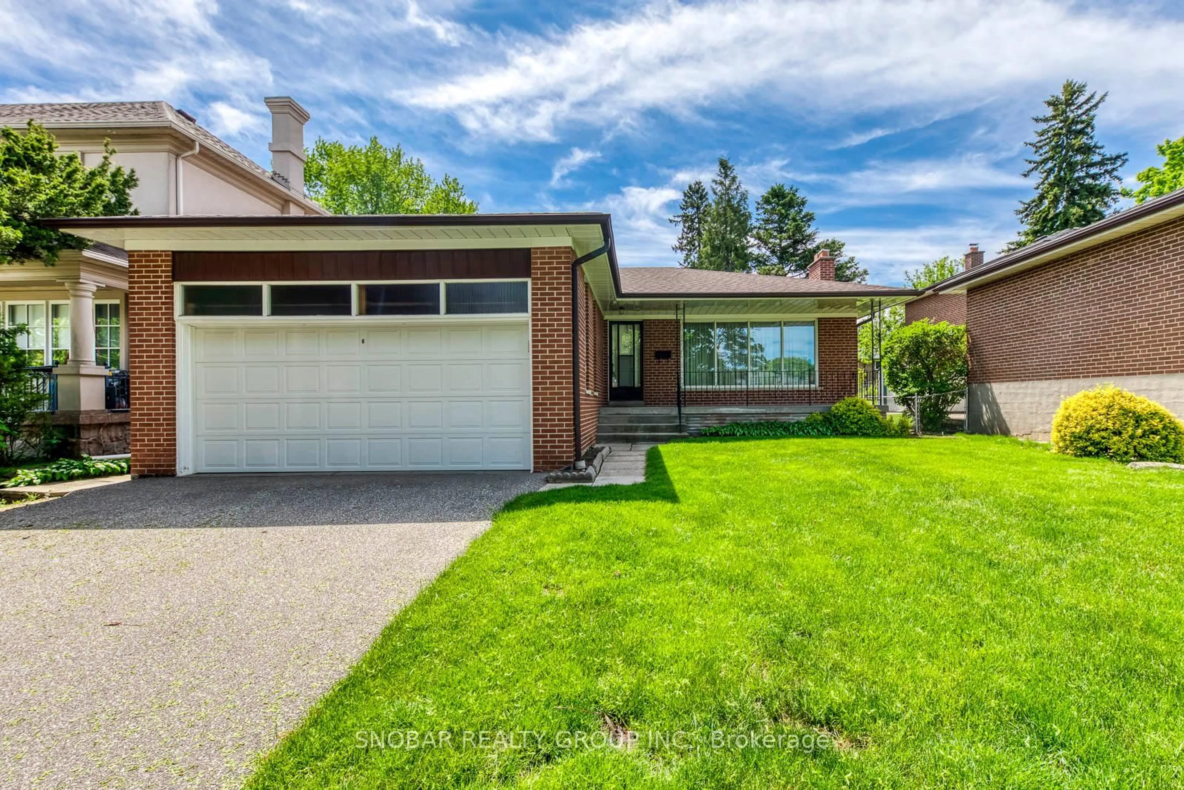 Home with brick exterior material, street for 301 La Rose Ave, Toronto Ontario M9P 1B8