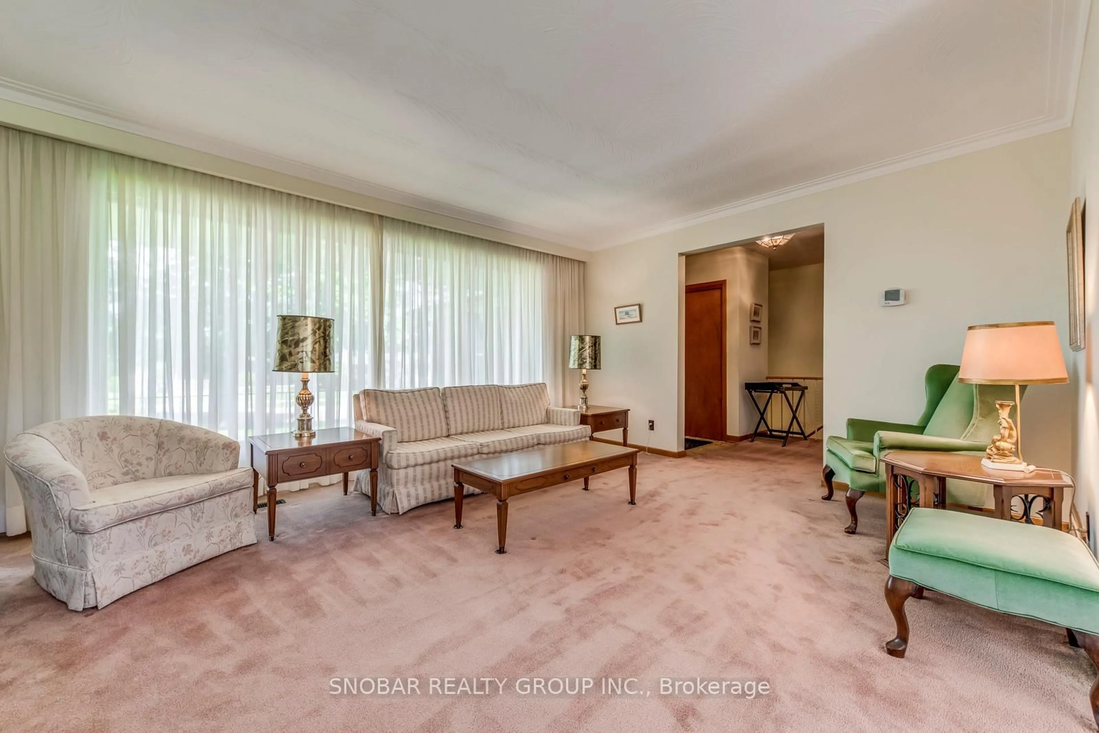 Living room with furniture, carpet floor for 301 La Rose Ave, Toronto Ontario M9P 1B8