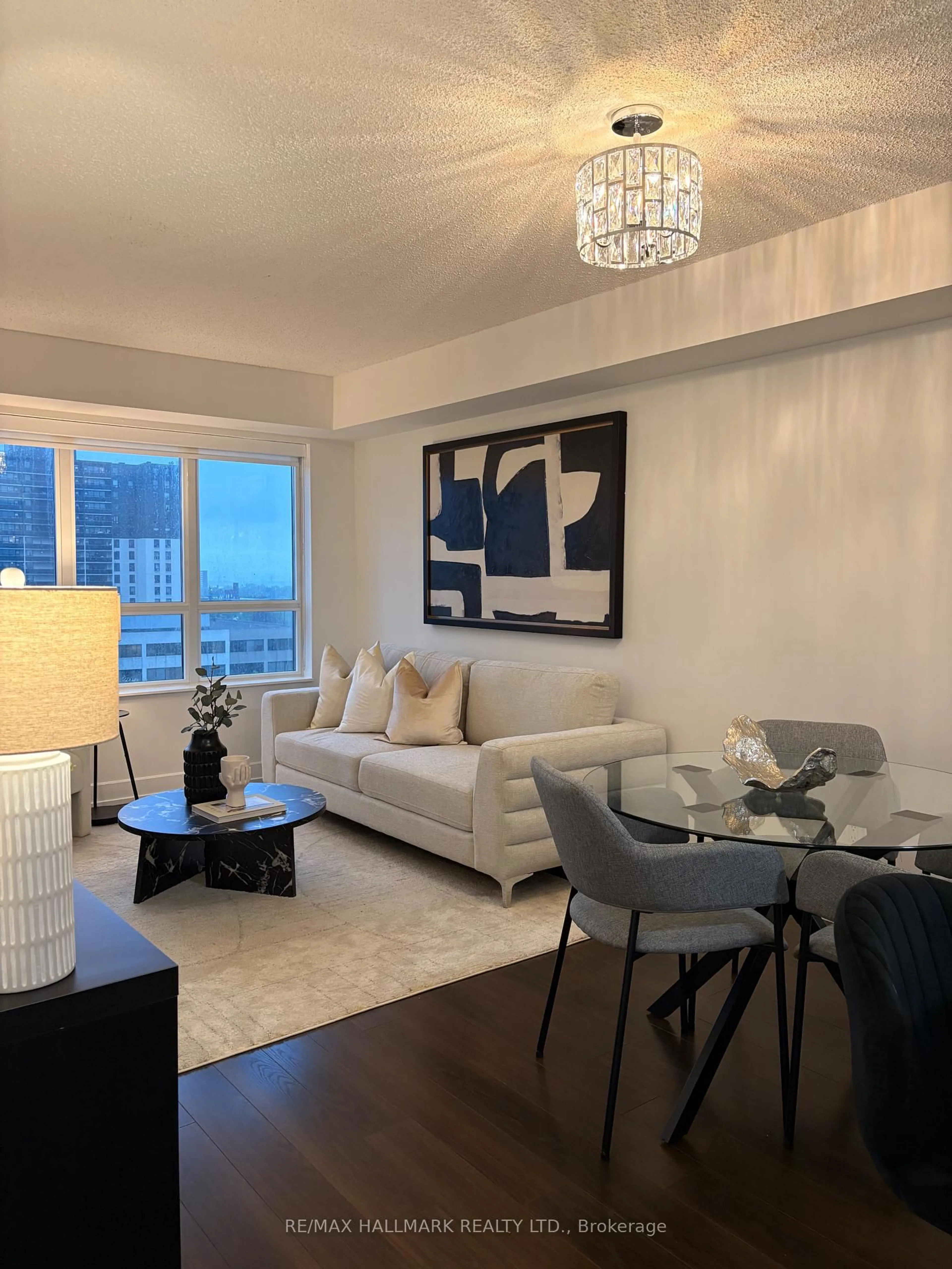Living room with furniture, wood/laminate floor for 2 EVA Rd #628, Toronto Ontario M9C 2A8