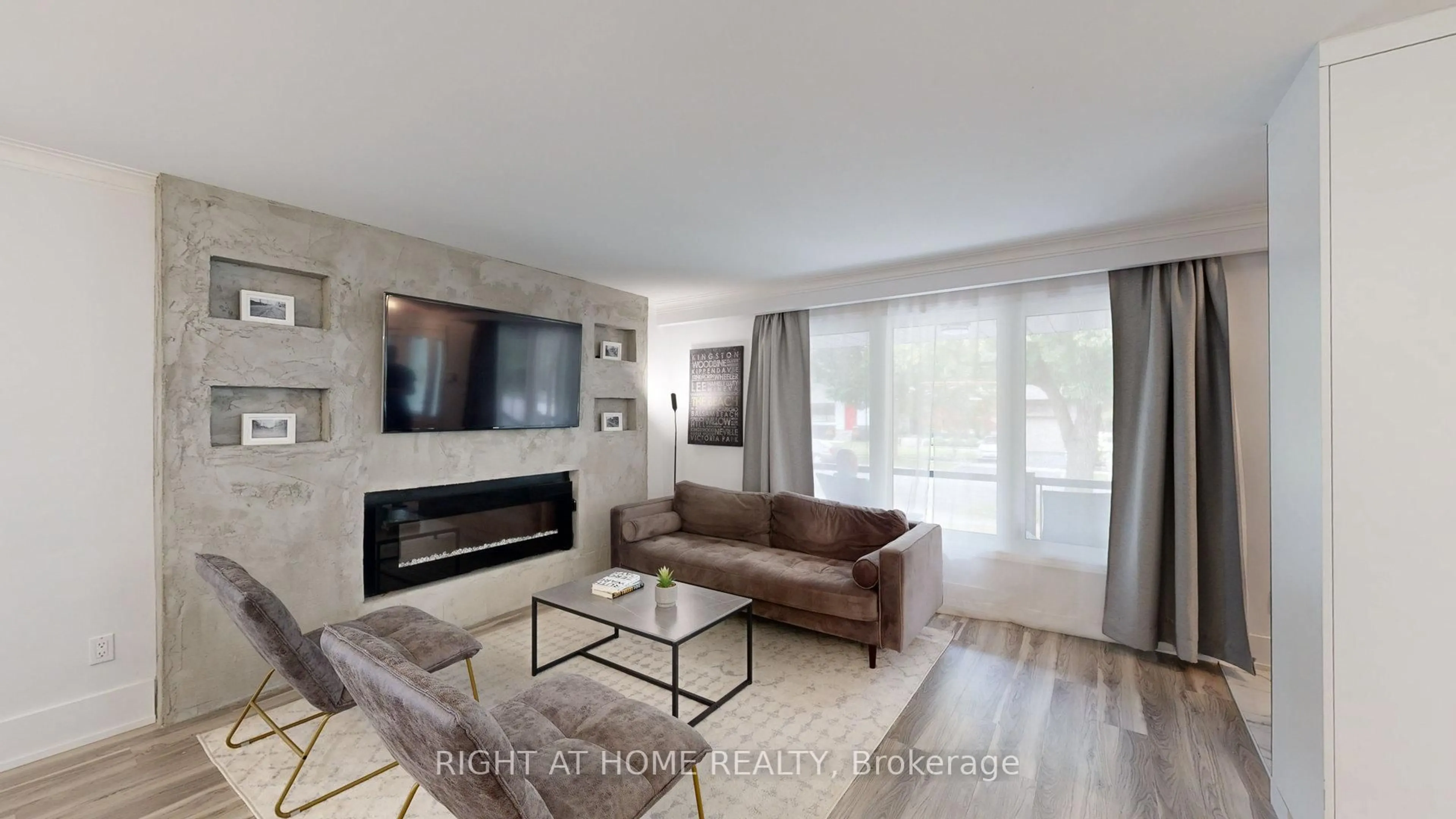 Living room with furniture, wood/laminate floor for 1492 Agnew Rd, Mississauga Ontario L5J 3G9