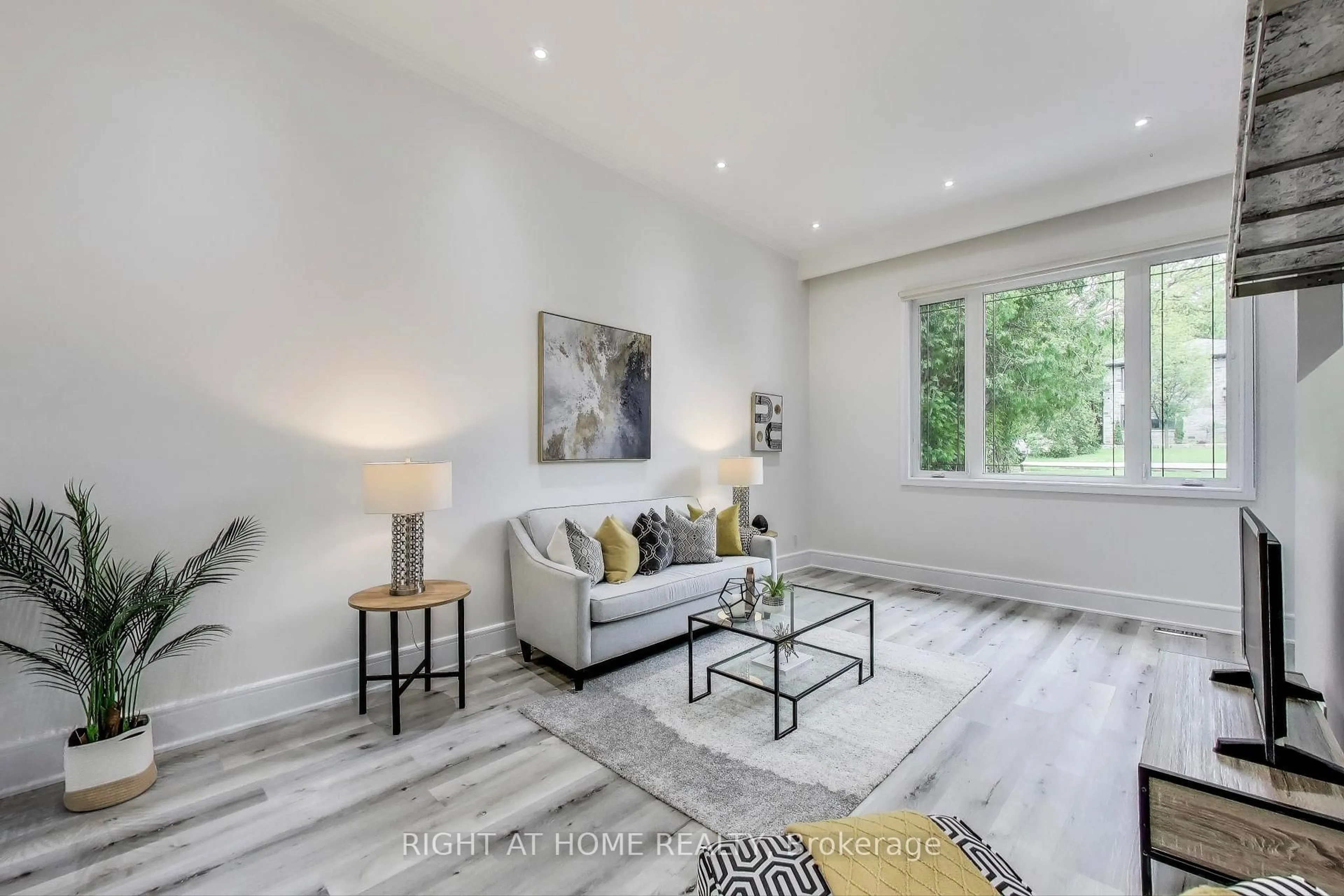 Living room with furniture, wood/laminate floor for 43 Hedges Blvd, Toronto Ontario M9B 3C3