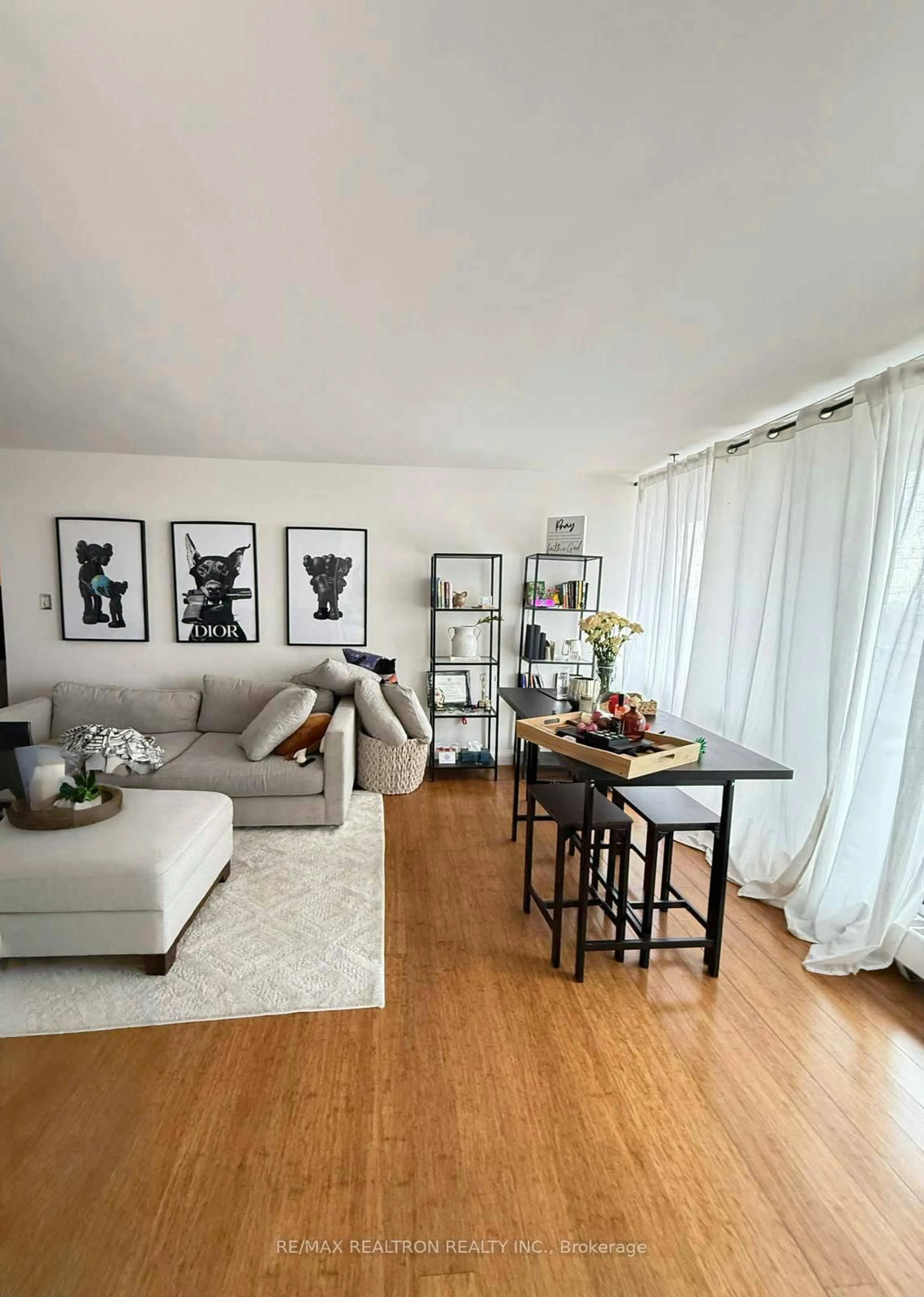 Living room with furniture, wood/laminate floor for 31 Four Winds Dr #1014, Toronto Ontario M3J 1K9