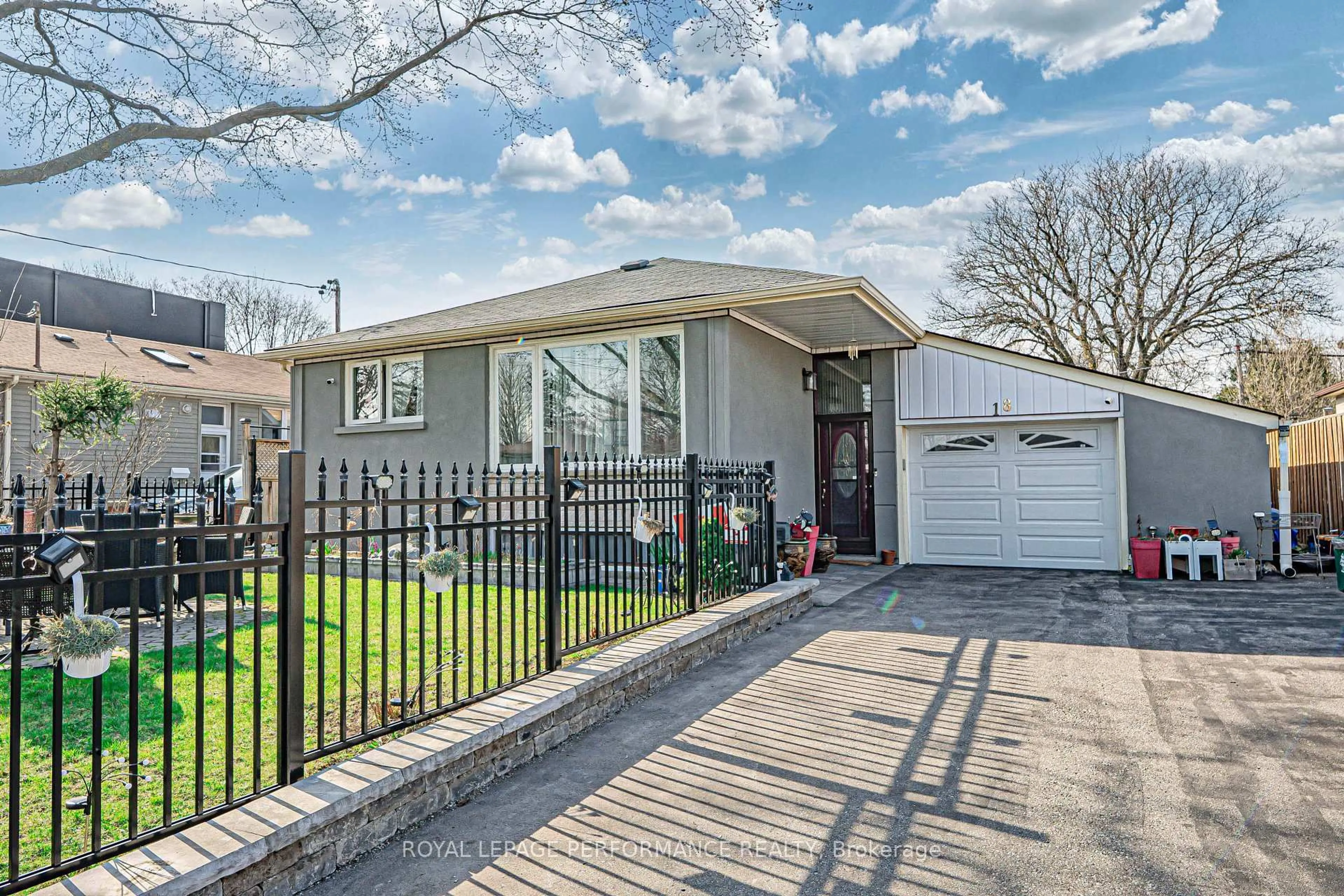 Home with brick exterior material, street for 18 Courtwright Rd, Toronto Ontario M9C 4B4