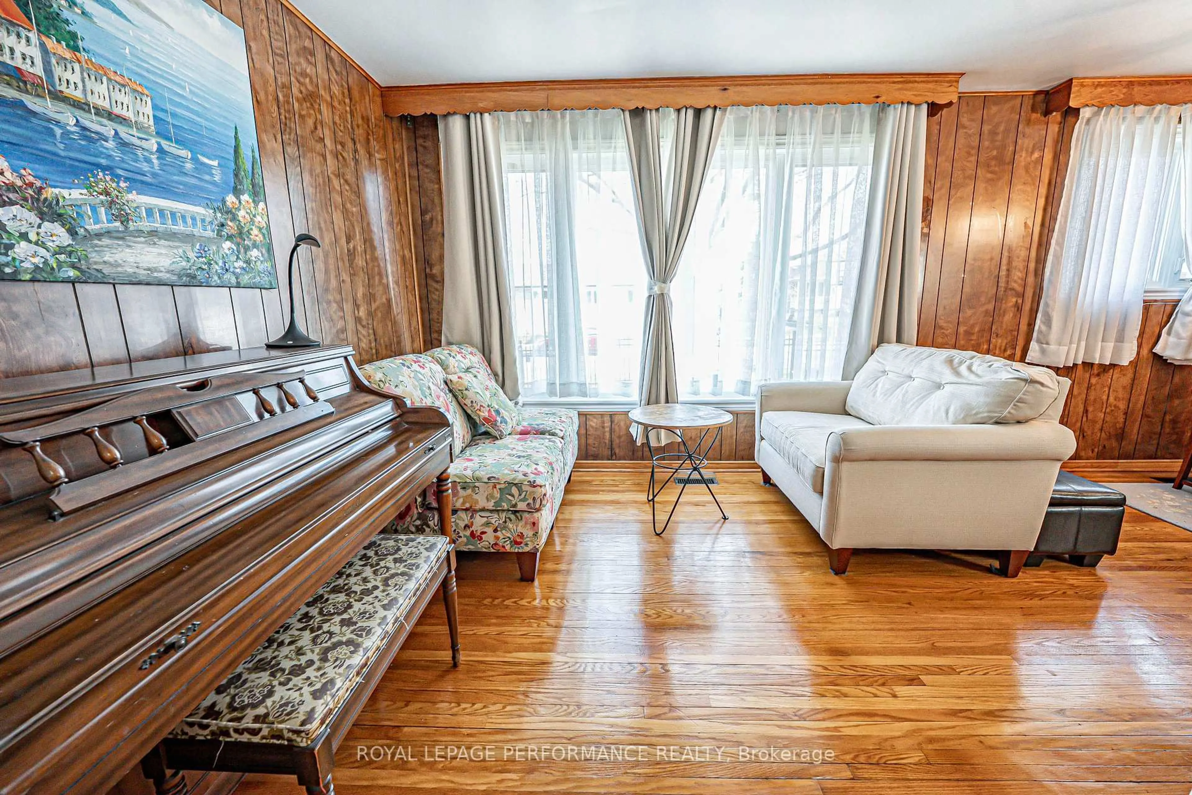 Living room with furniture, wood/laminate floor for 18 Courtwright Rd, Toronto Ontario M9C 4B4