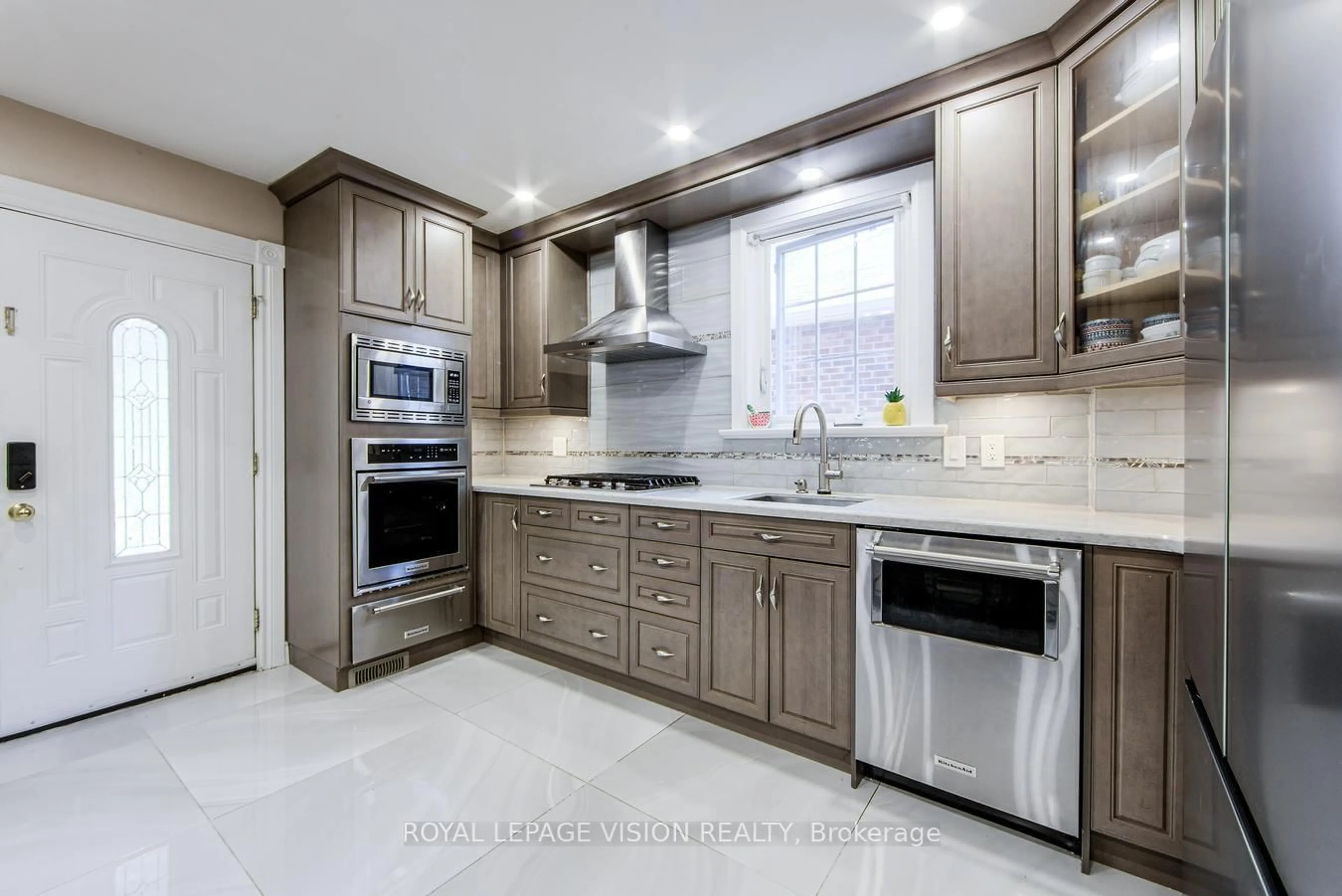 Open concept kitchen, ceramic/tile floor for 79 Foxwell St, Toronto Ontario M6N 1Y9