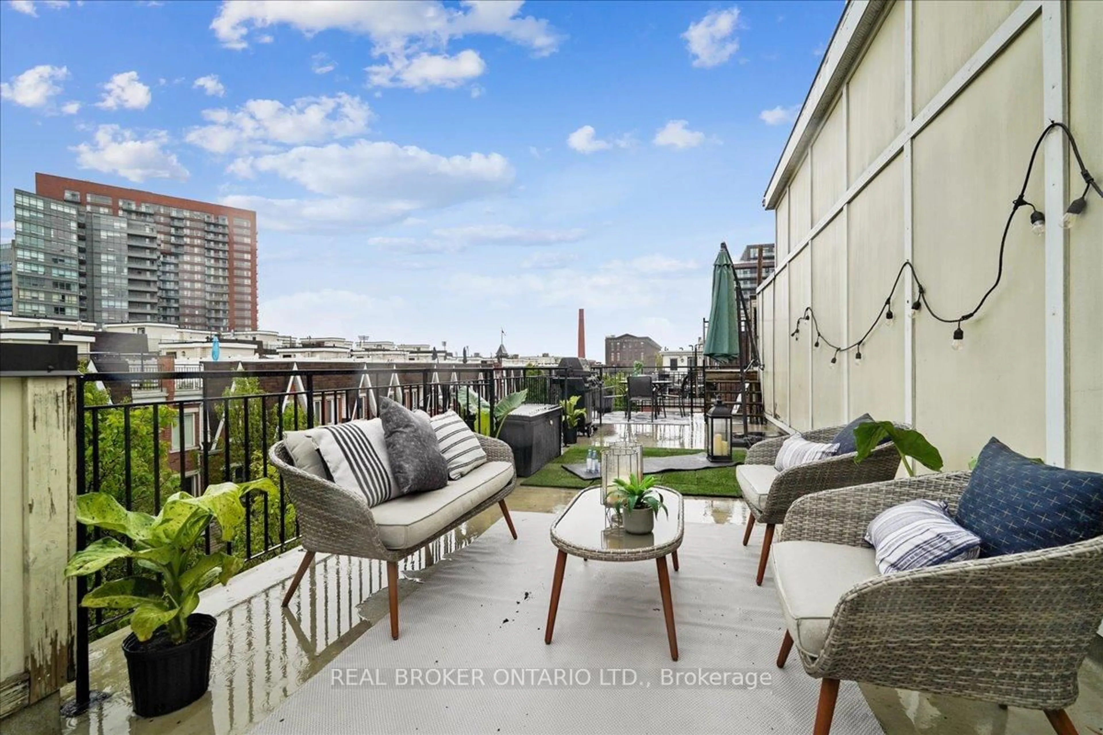 Patio, city buildings view from balcony for 22 Laidlaw St #1233C, Toronto Ontario M6K 1X2