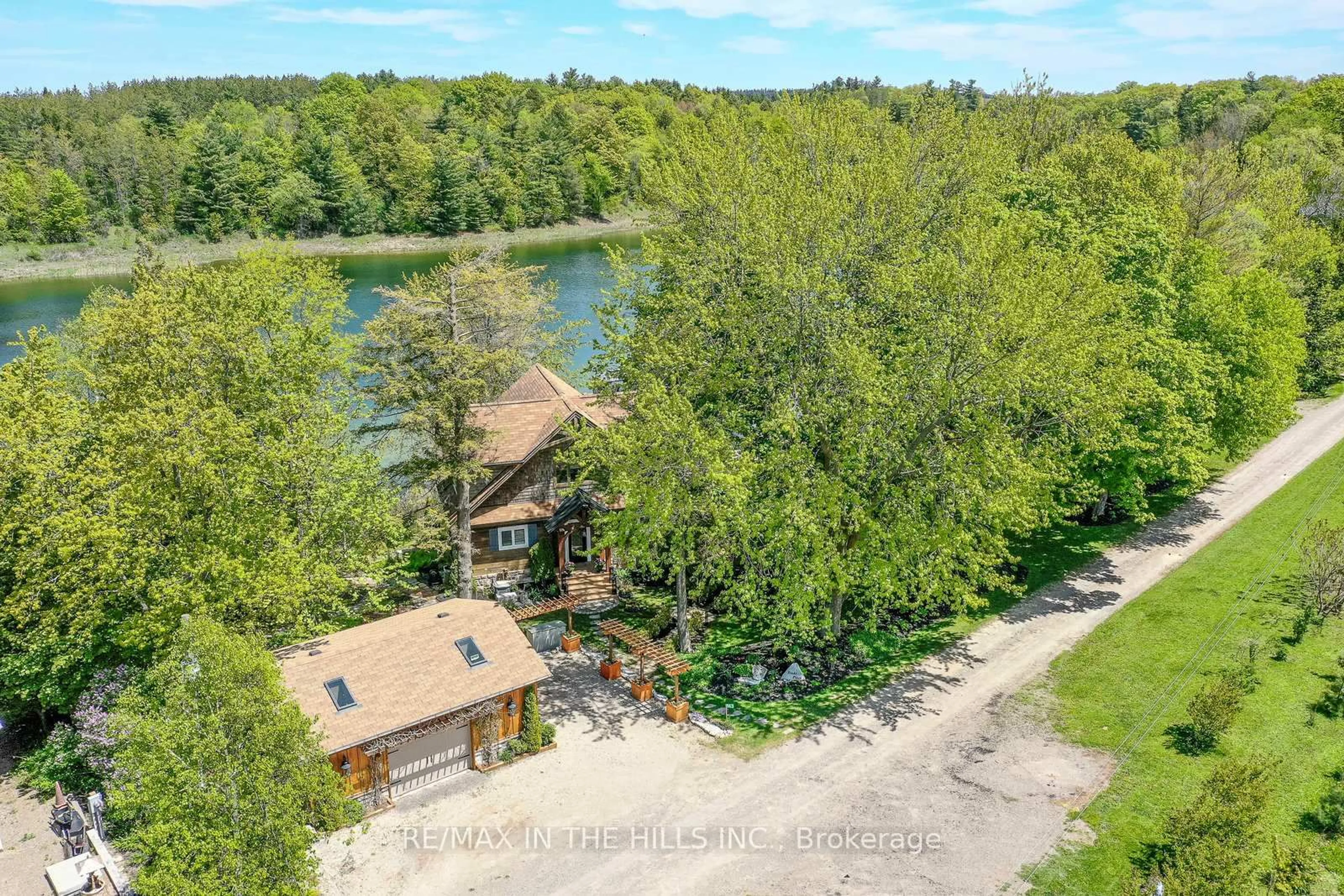 A pic from outside/outdoor area/front of a property/back of a property/a pic from drone, water/lake/river/ocean view for 143 Green Lake Rd #143, Caledon Ontario L7K 0S4