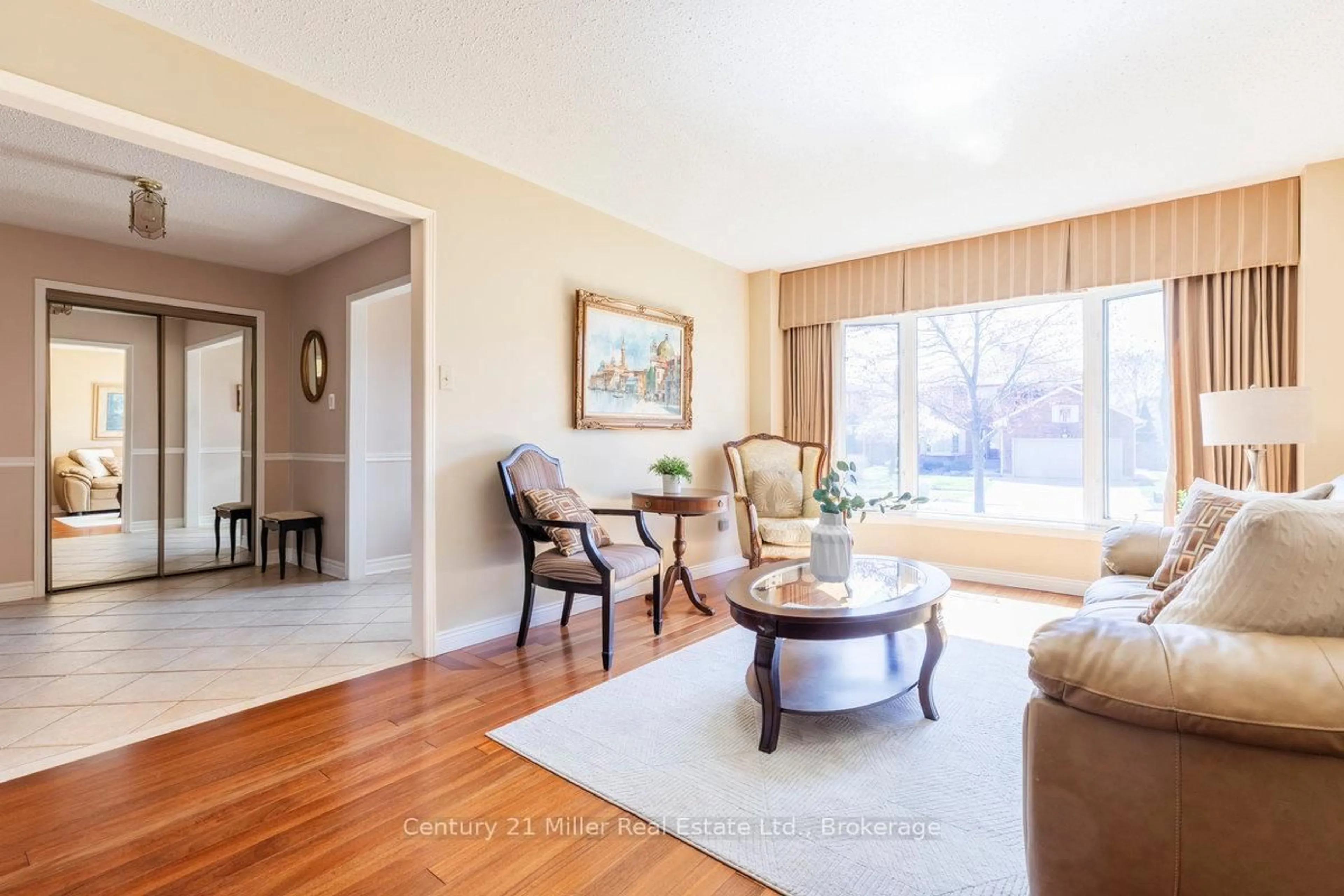 Living room with furniture, wood/laminate floor for 1179 Rosethorne Rd, Oakville Ontario L6M 1H5