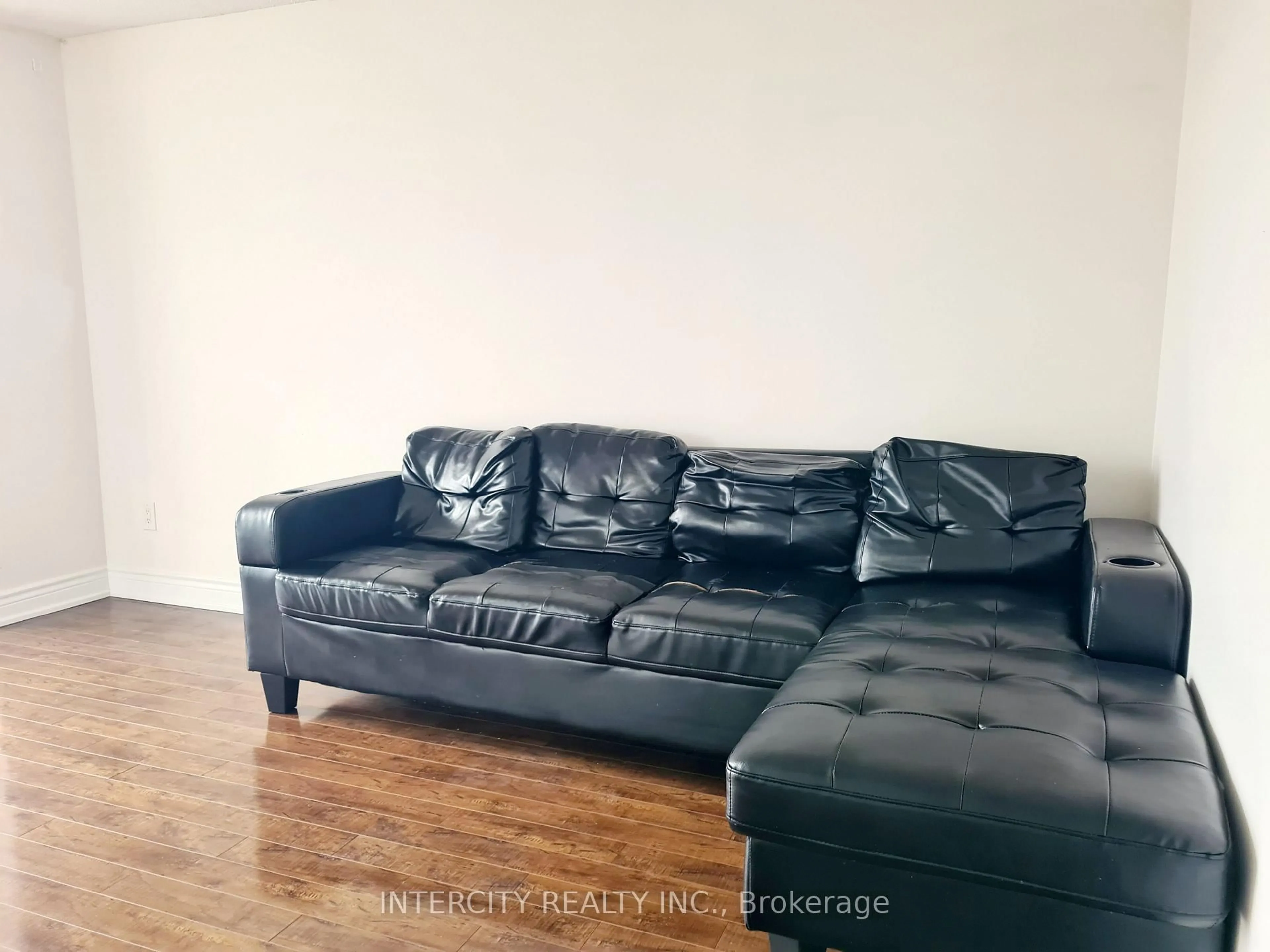 Living room with furniture, wood/laminate floor for 3077 Weston Rd #1105, Toronto Ontario M9M 3A1