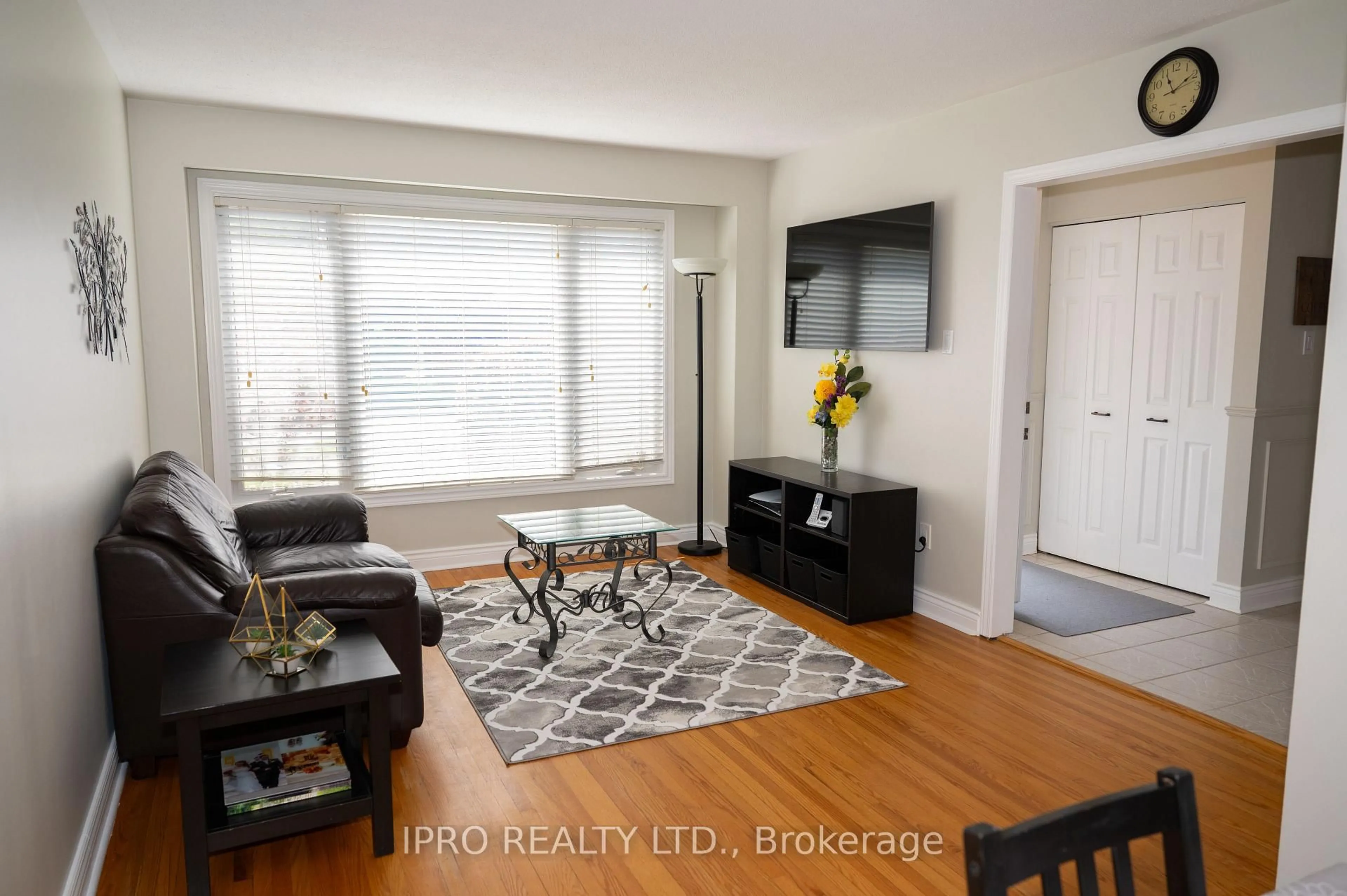 Living room with furniture, wood/laminate floor for 31 Madison Ave, Orangeville Ontario L9W 1R9
