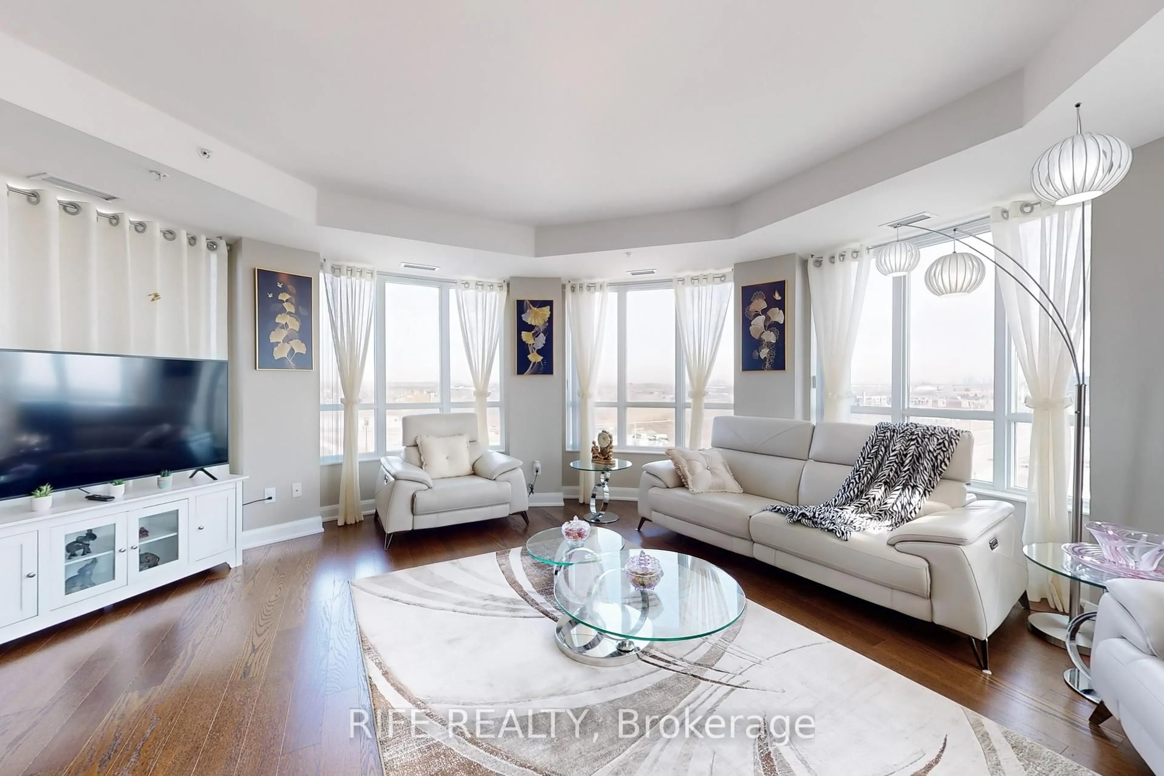 Living room with furniture, unknown for 2480 Prince Michael Dr #621, Oakville Ontario L6H 0E9