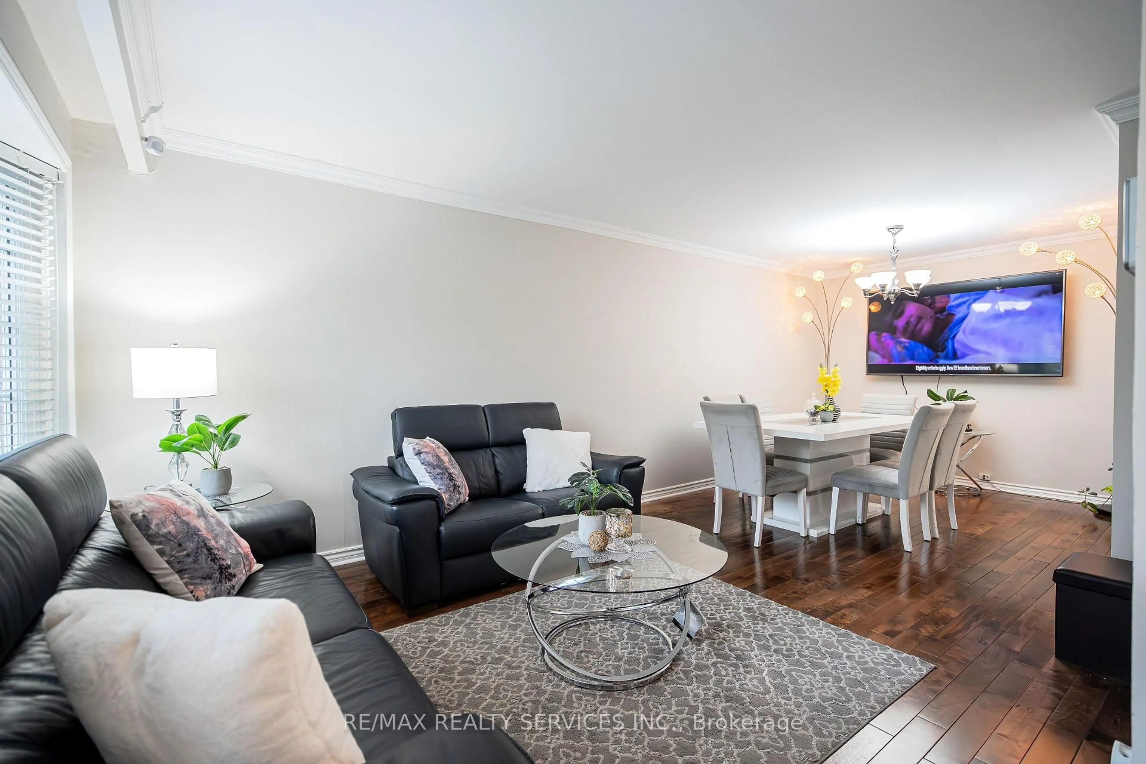 Living room with furniture, wood/laminate floor for 41 Mallard Cres, Brampton Ontario L6S 2T7