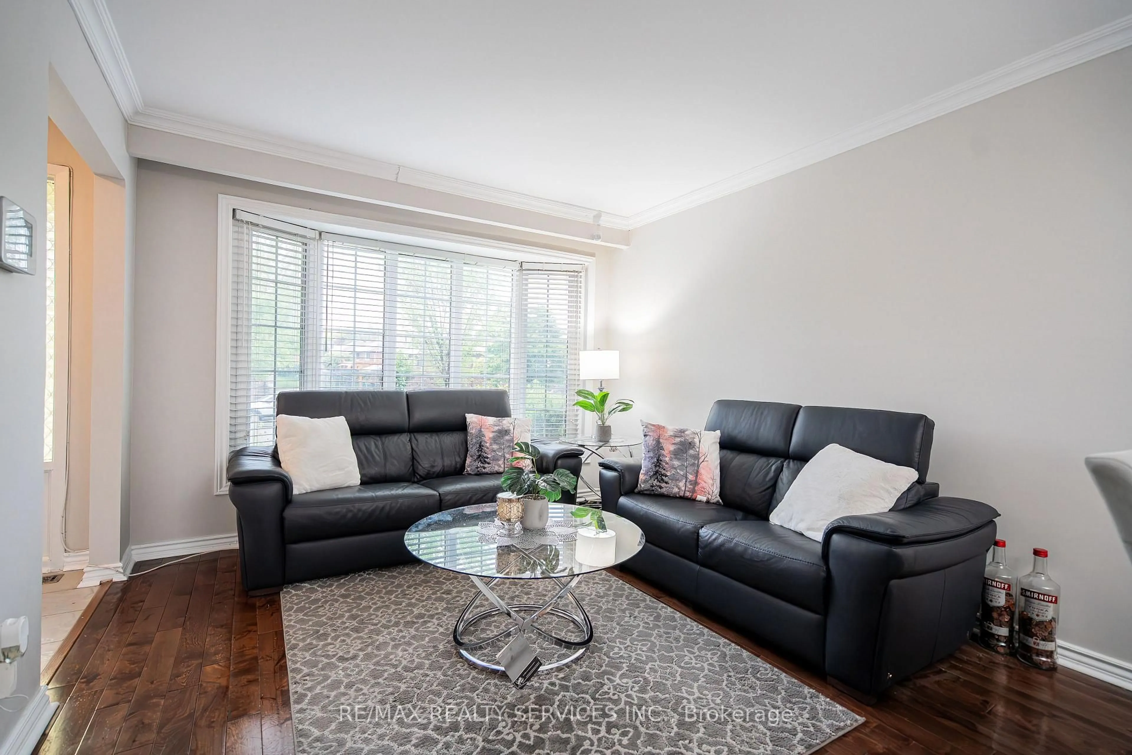 Living room with furniture, wood/laminate floor for 41 Mallard Cres, Brampton Ontario L6S 2T7