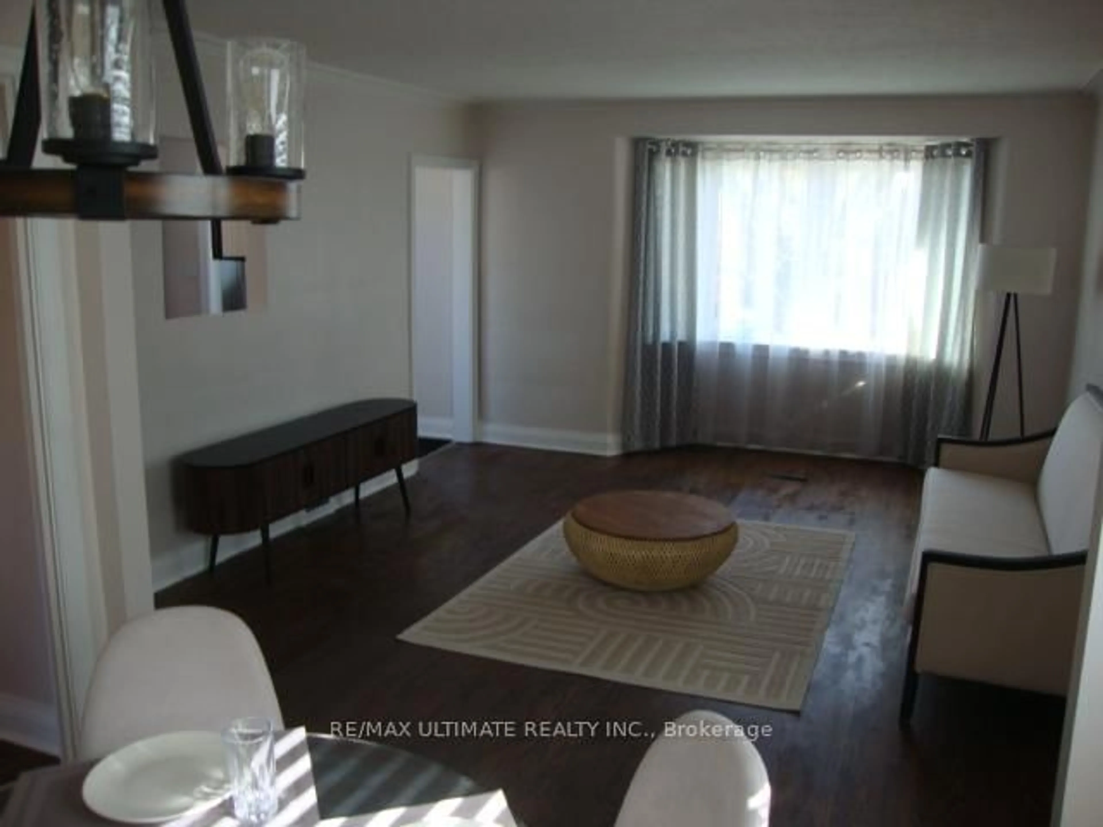 Living room with furniture, wood/laminate floor for 20 Boyd Ave, Toronto Ontario M9N 2C7