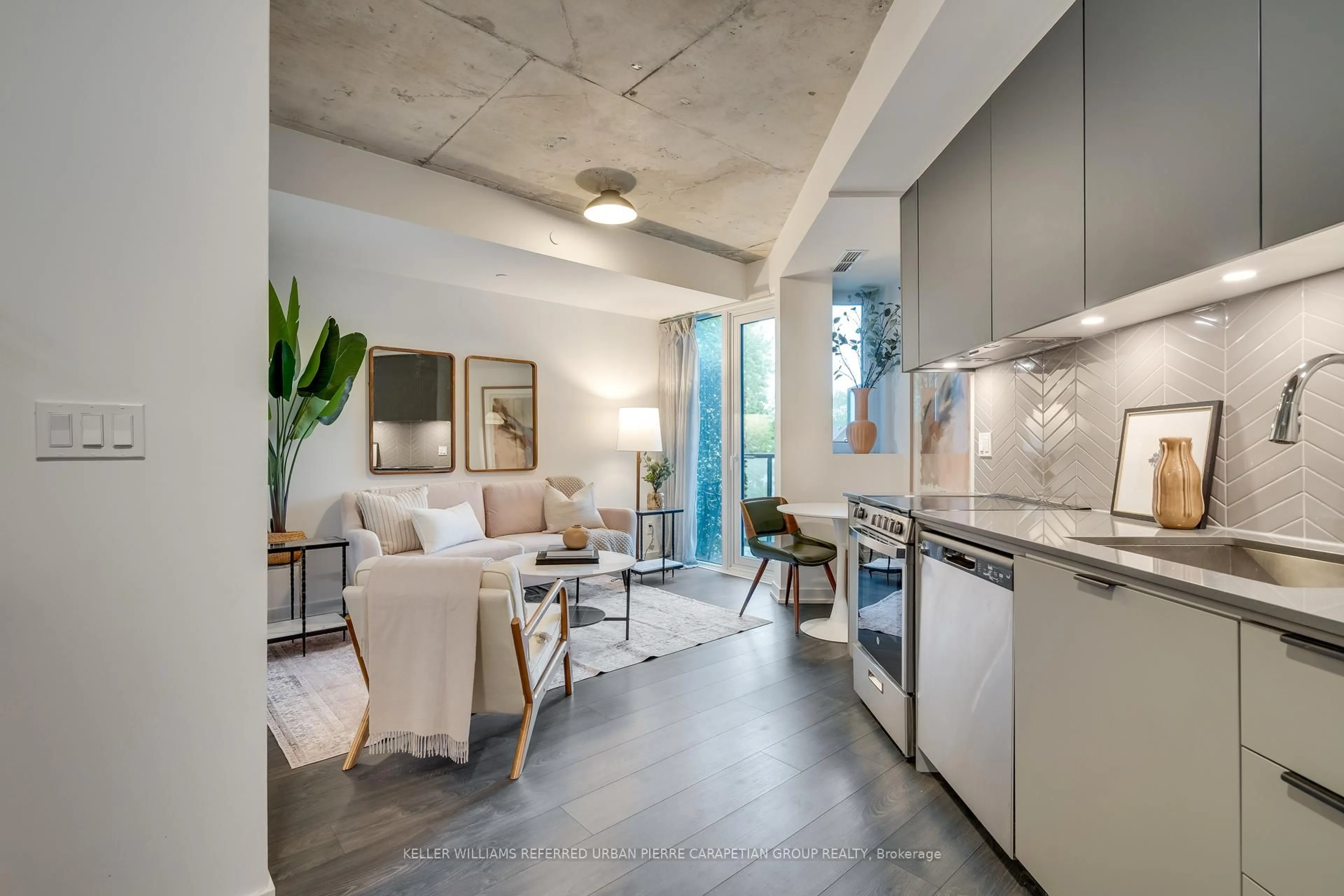Open concept kitchen, cement floor for 57 Brock Ave #316, Toronto Ontario M6K 2L3