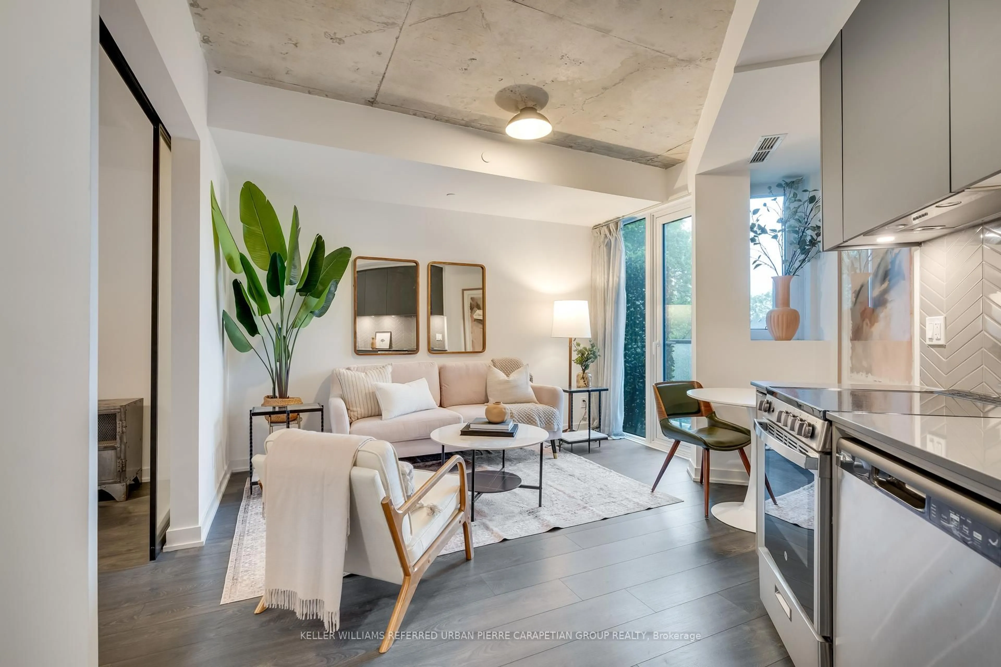 Living room with furniture, cement floor for 57 Brock Ave #316, Toronto Ontario M6K 2L3