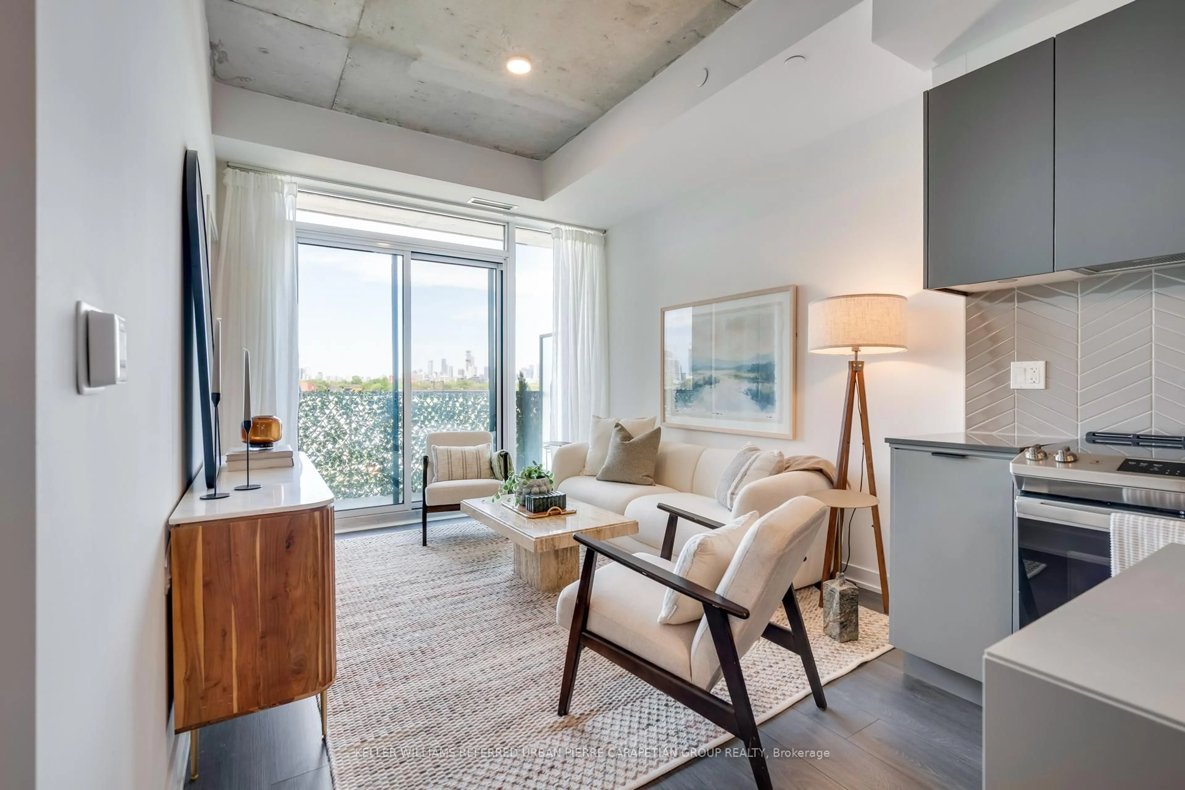 Living room with furniture, cement floor for 57 Brock Ave #608, Toronto Ontario M3H 3N2