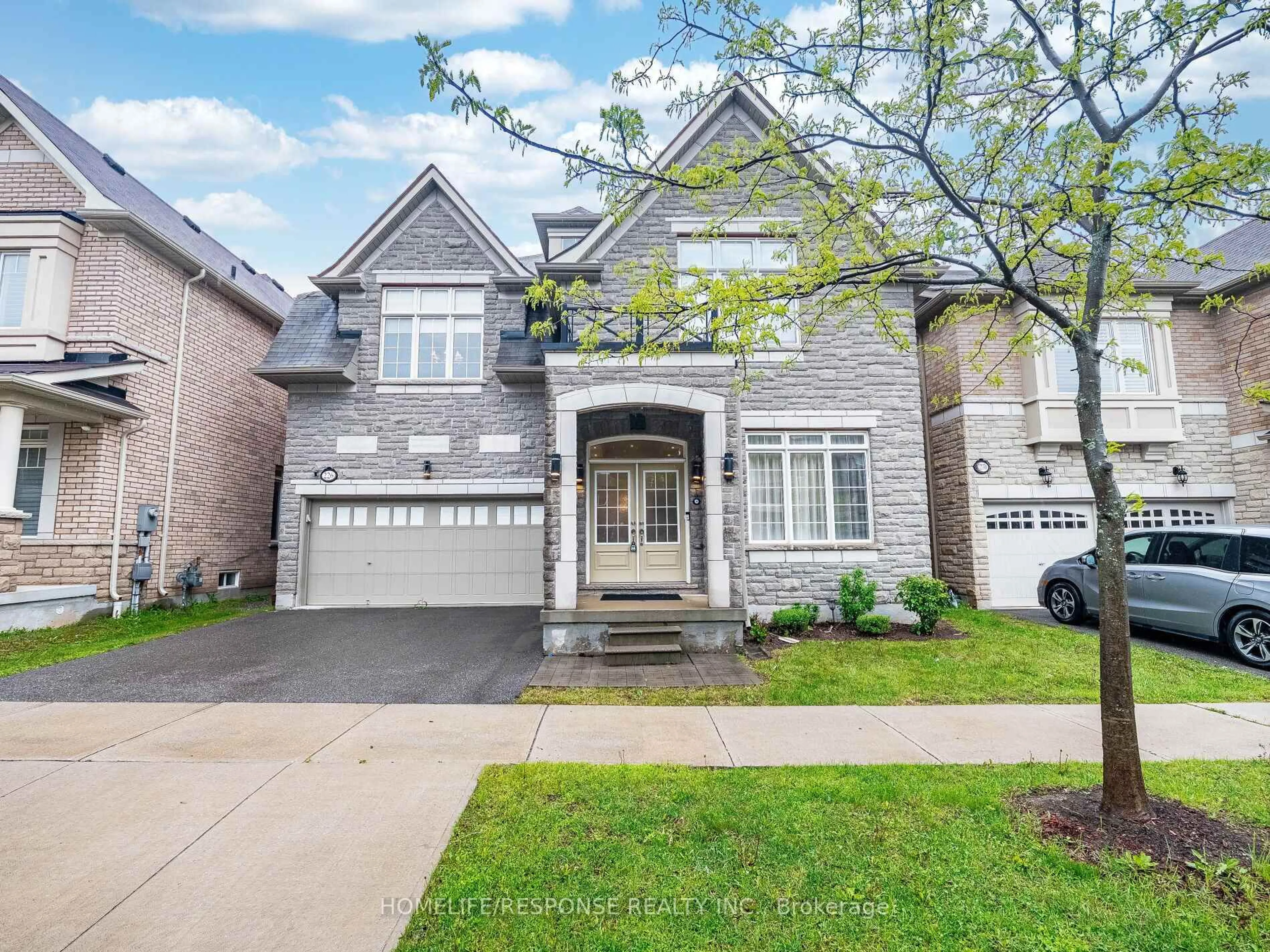 Home with brick exterior material, street for 226 JESSIE CAVERHILL Passage, Oakville Ontario L7M 0Z6