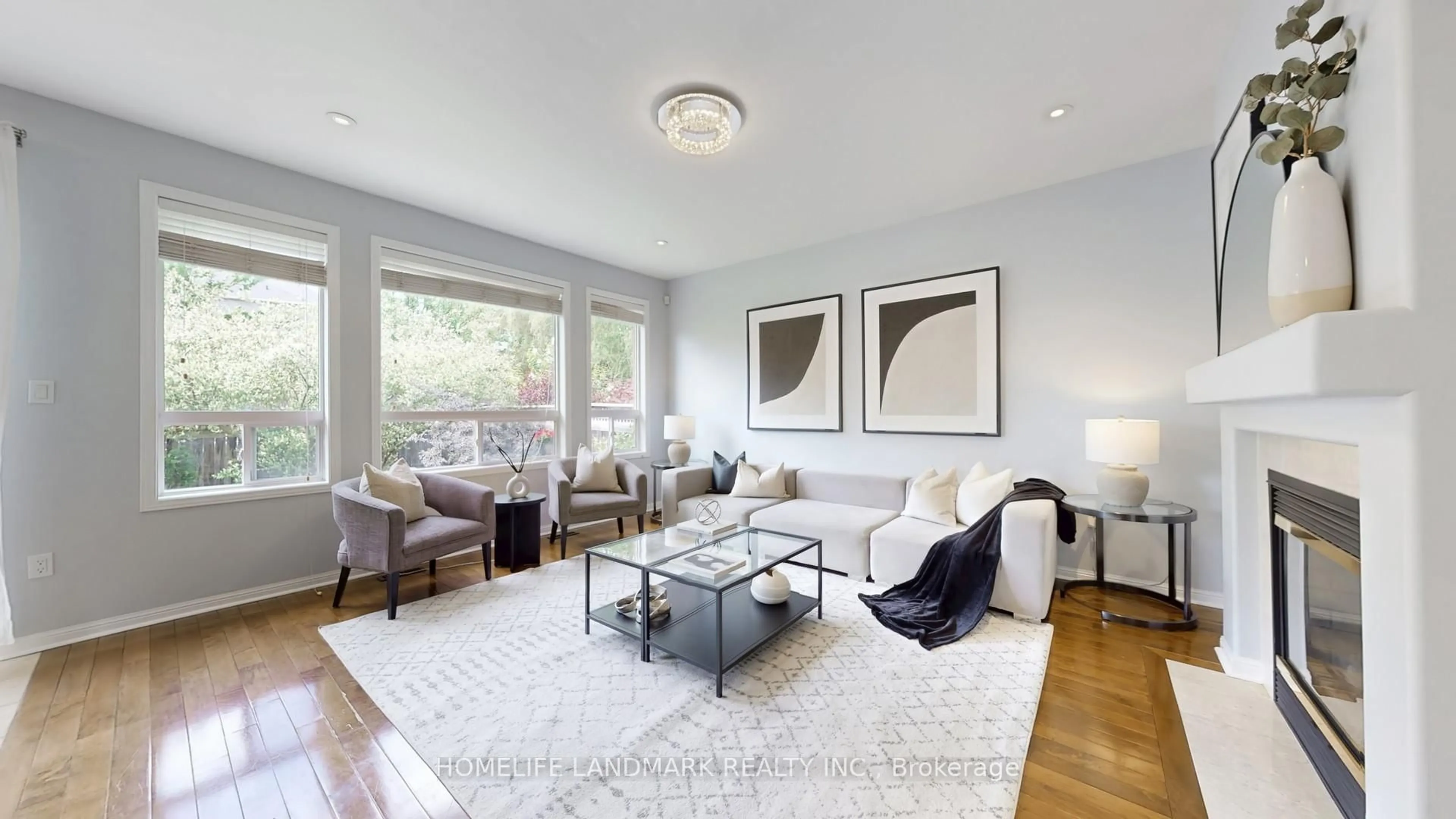 Living room with furniture, wood/laminate floor for 5392 Churchill Meadows Blvd, Mississauga Ontario L5M 7X9