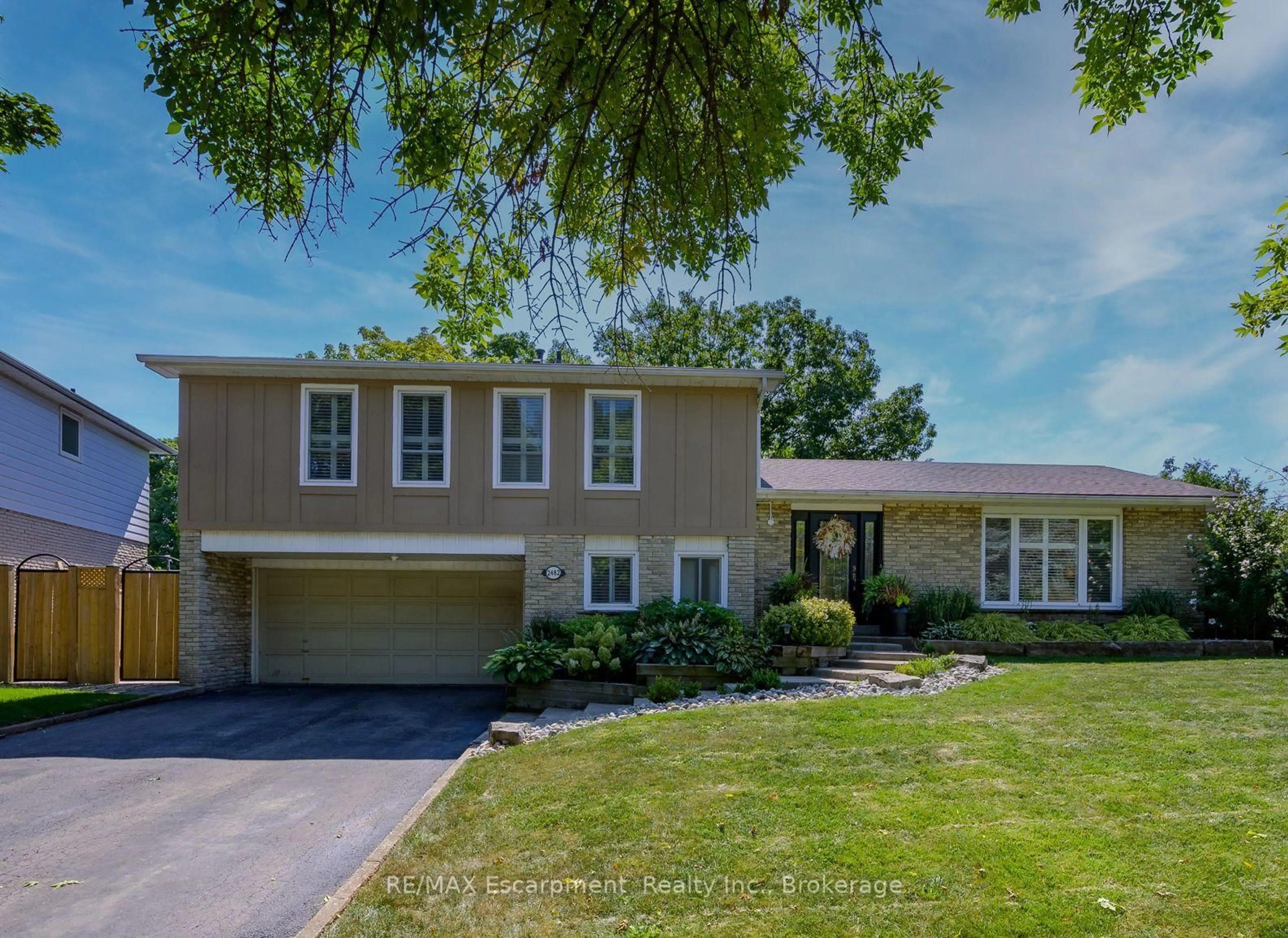 Home with vinyl exterior material, street for 2482 WATERFORD St, Oakville Ontario L6L 5E6