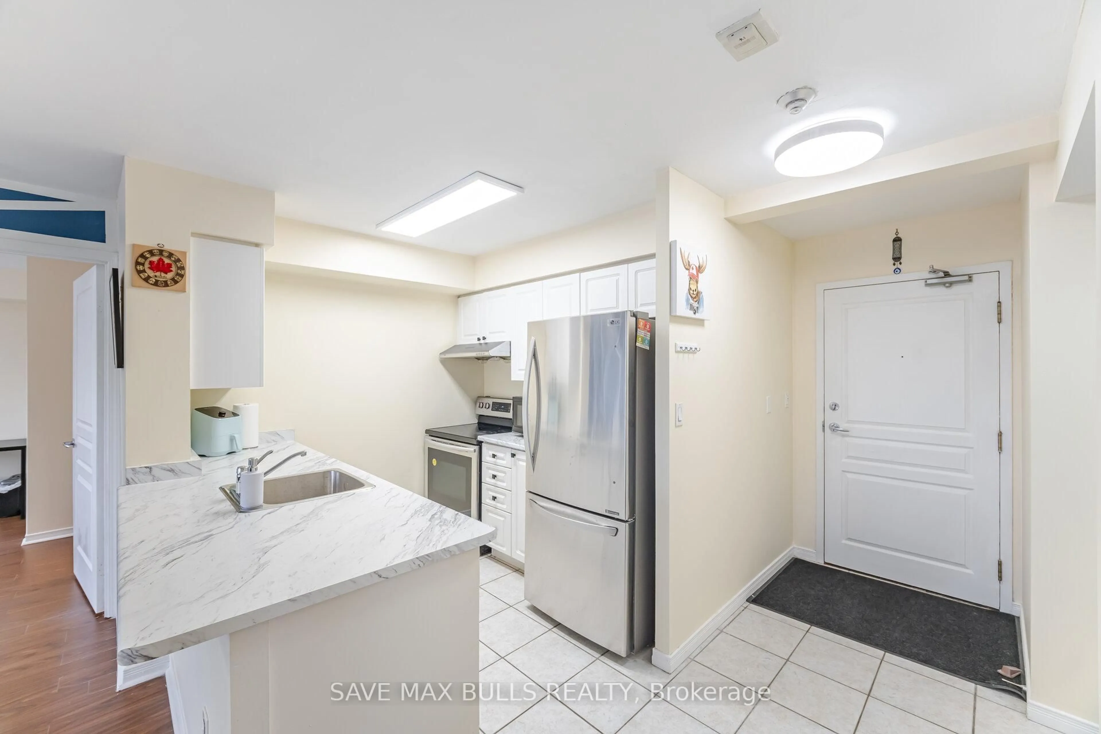 Standard kitchen, ceramic/tile floor for 300 Ray Lawson Blvd #303, Brampton Ontario L6Y 5H5
