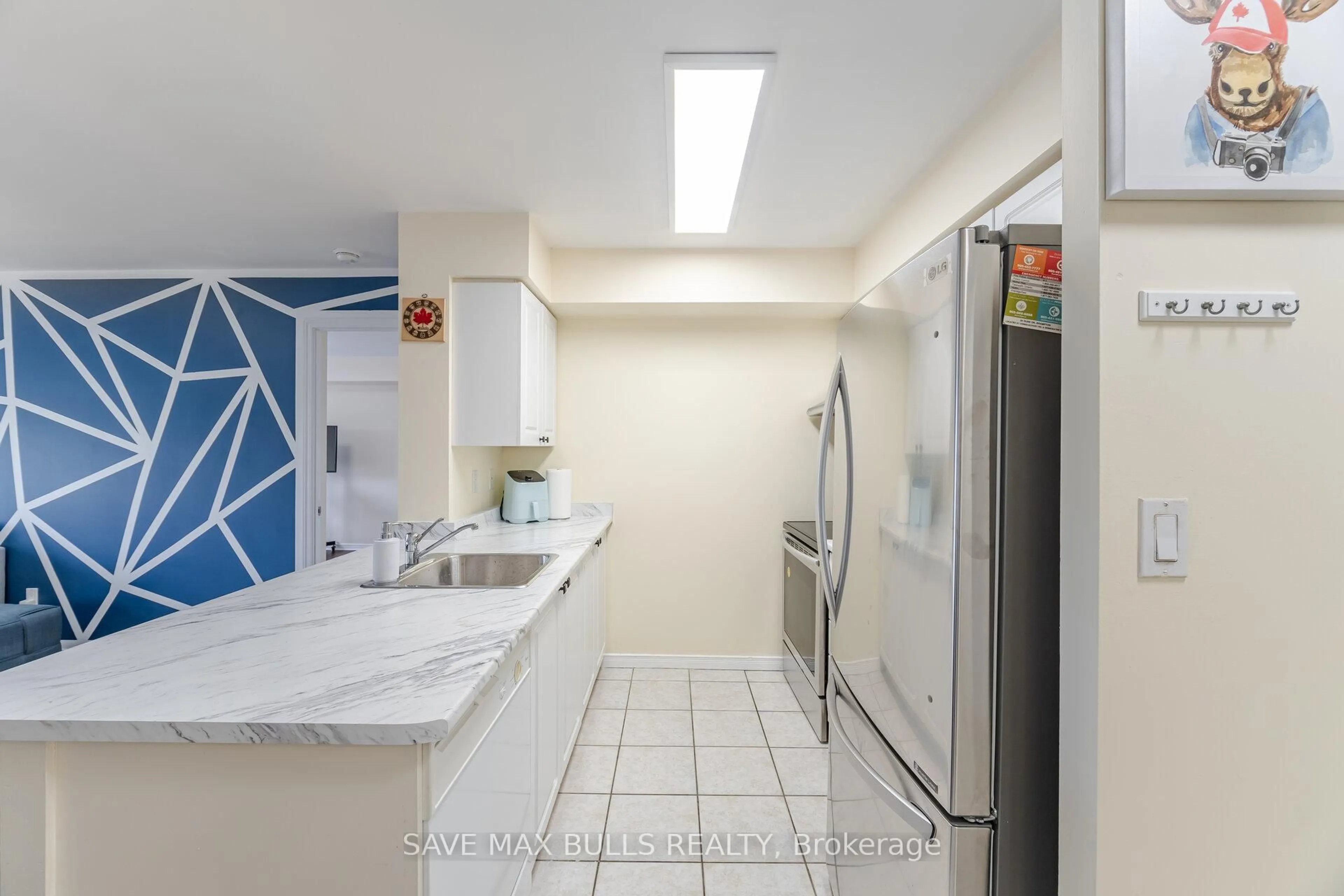 Standard kitchen, ceramic/tile floor for 300 Ray Lawson Blvd #303, Brampton Ontario L6Y 5H5