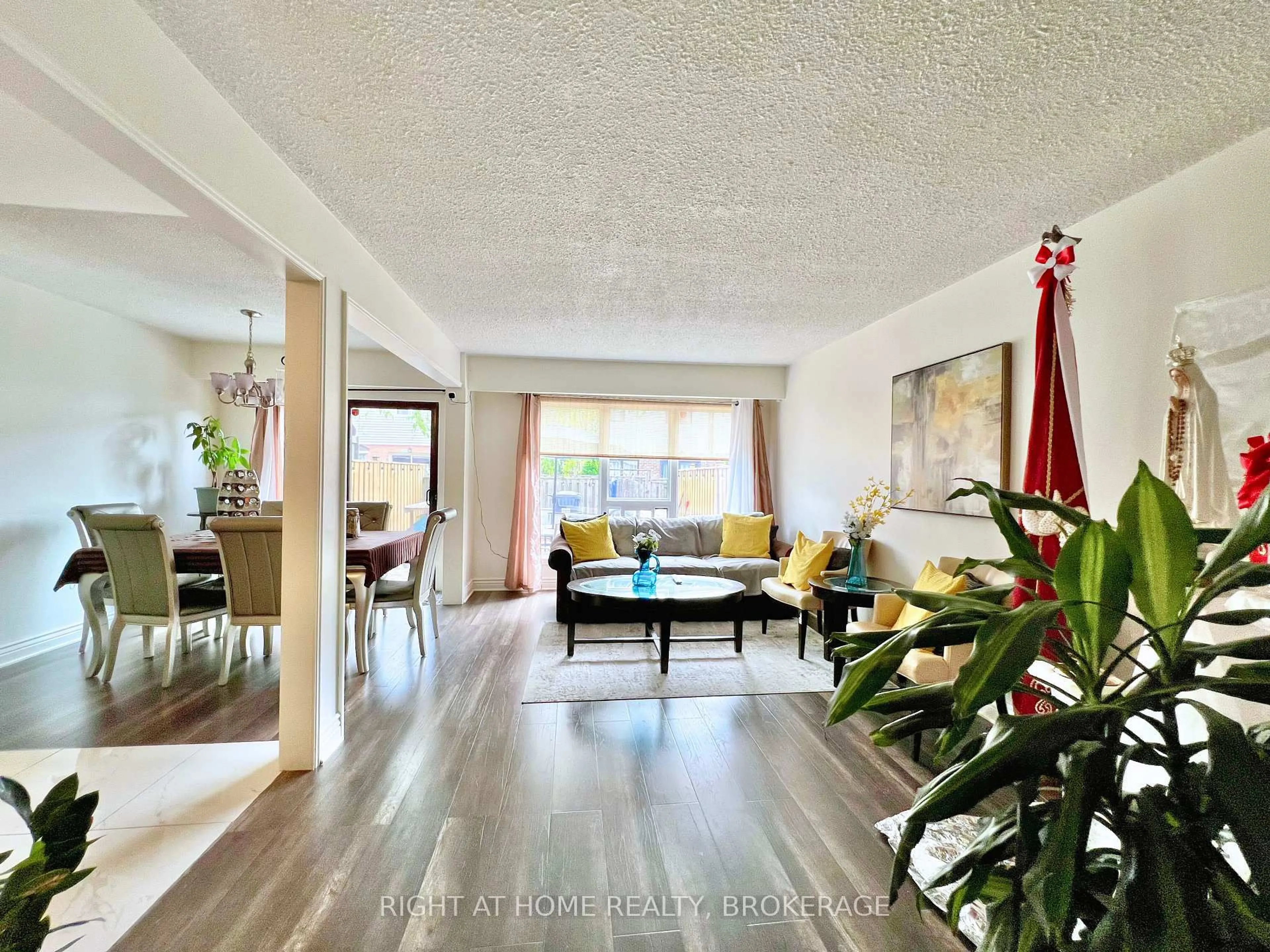 Living room with furniture, wood/laminate floor for 25 Baronwood Crt, Brampton Ontario L6V 3H6