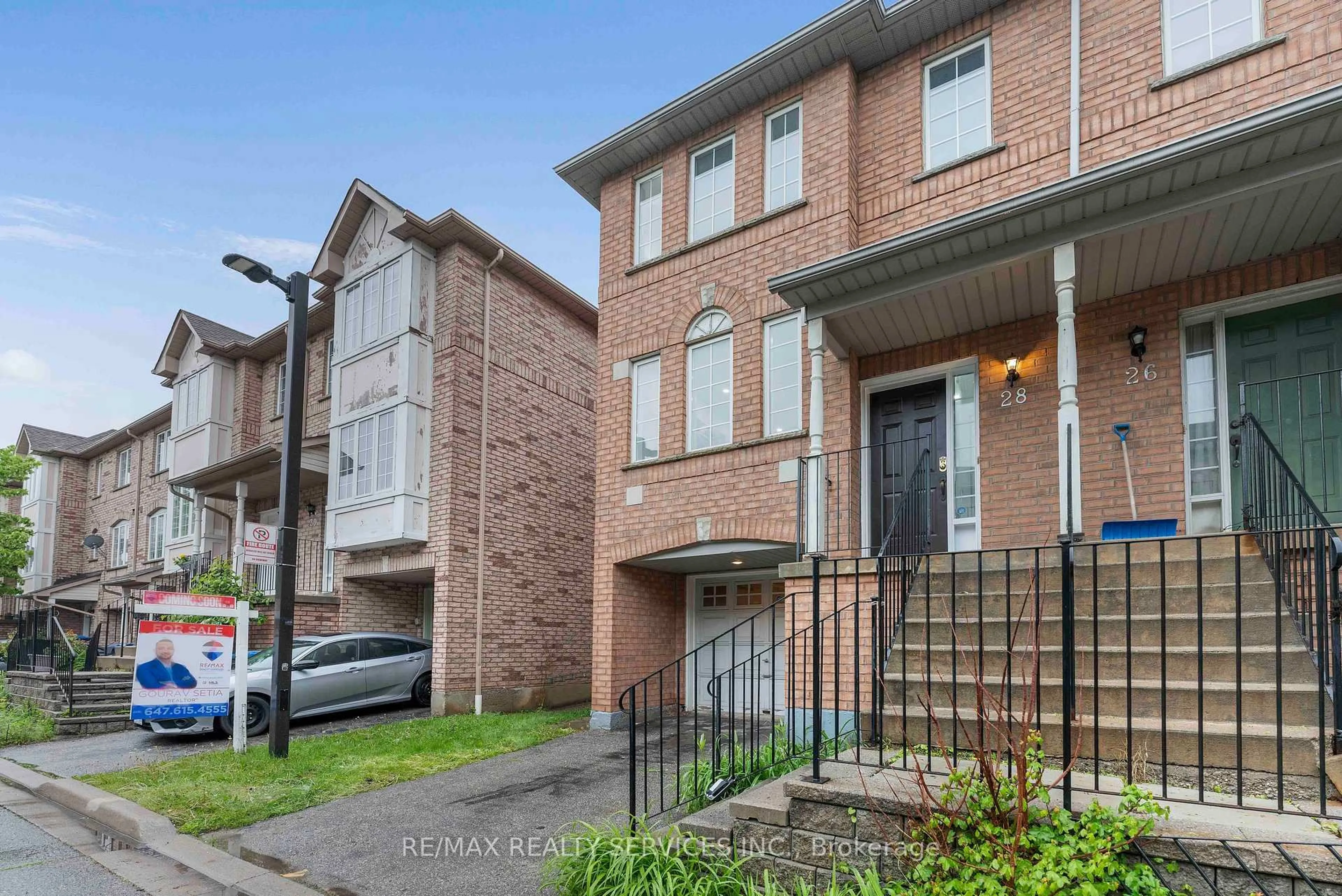 Home with brick exterior material, street for 80 Acorn Pl #28, Mississauga Ontario L4Z 4C9
