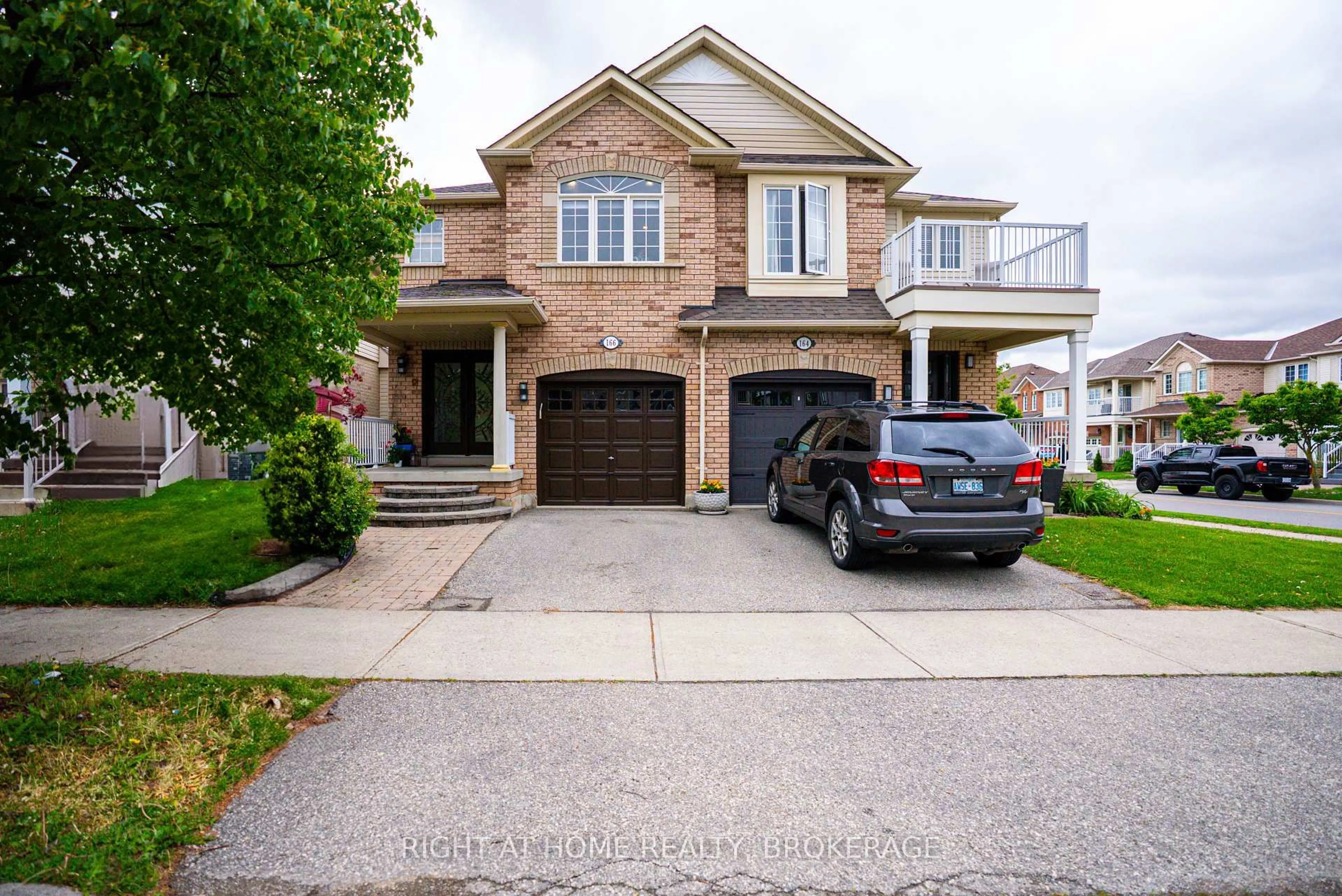 Home with brick exterior material, street for 166 Hampshire Way, Milton Ontario L9T 6B7