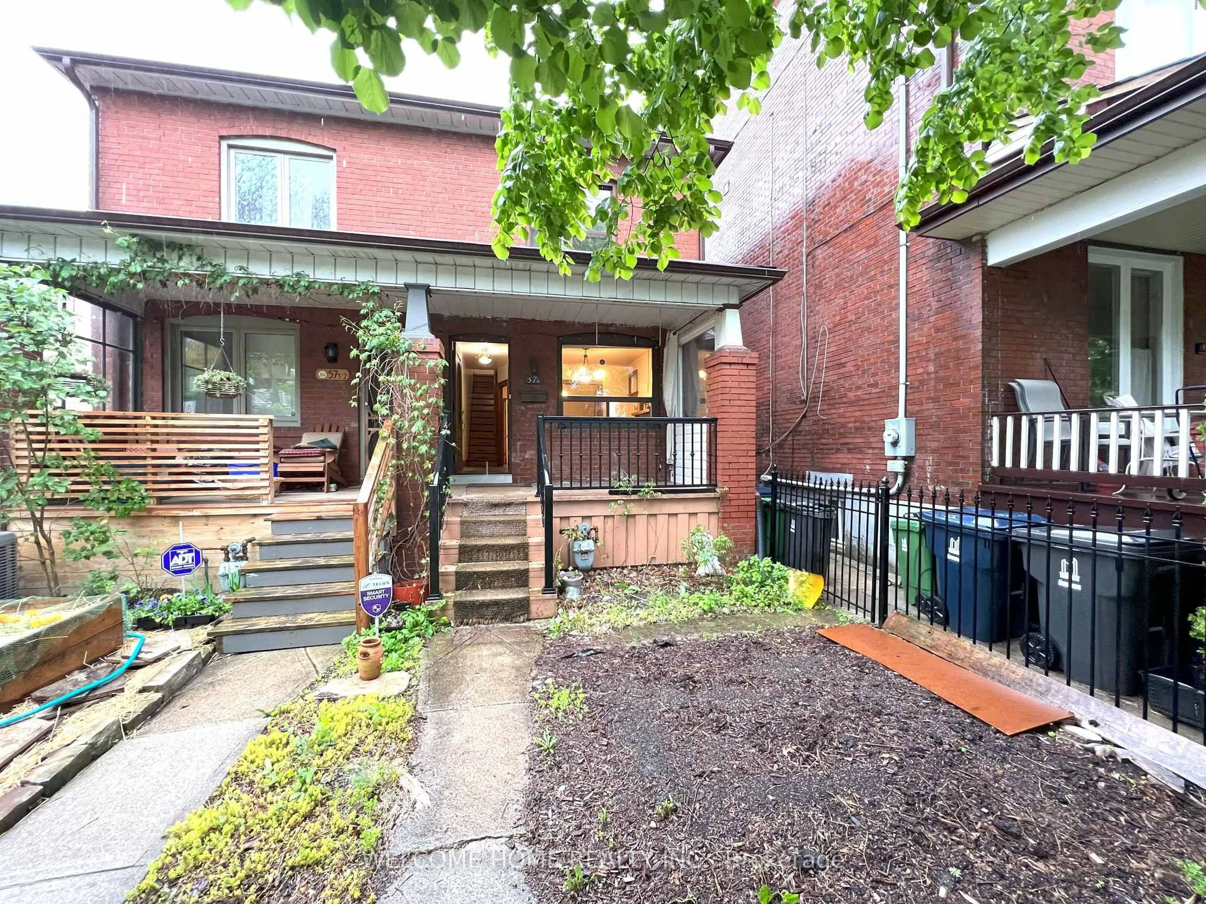 Home with brick exterior material, street for 57A Melville Ave, Toronto Ontario M6G 1Y3