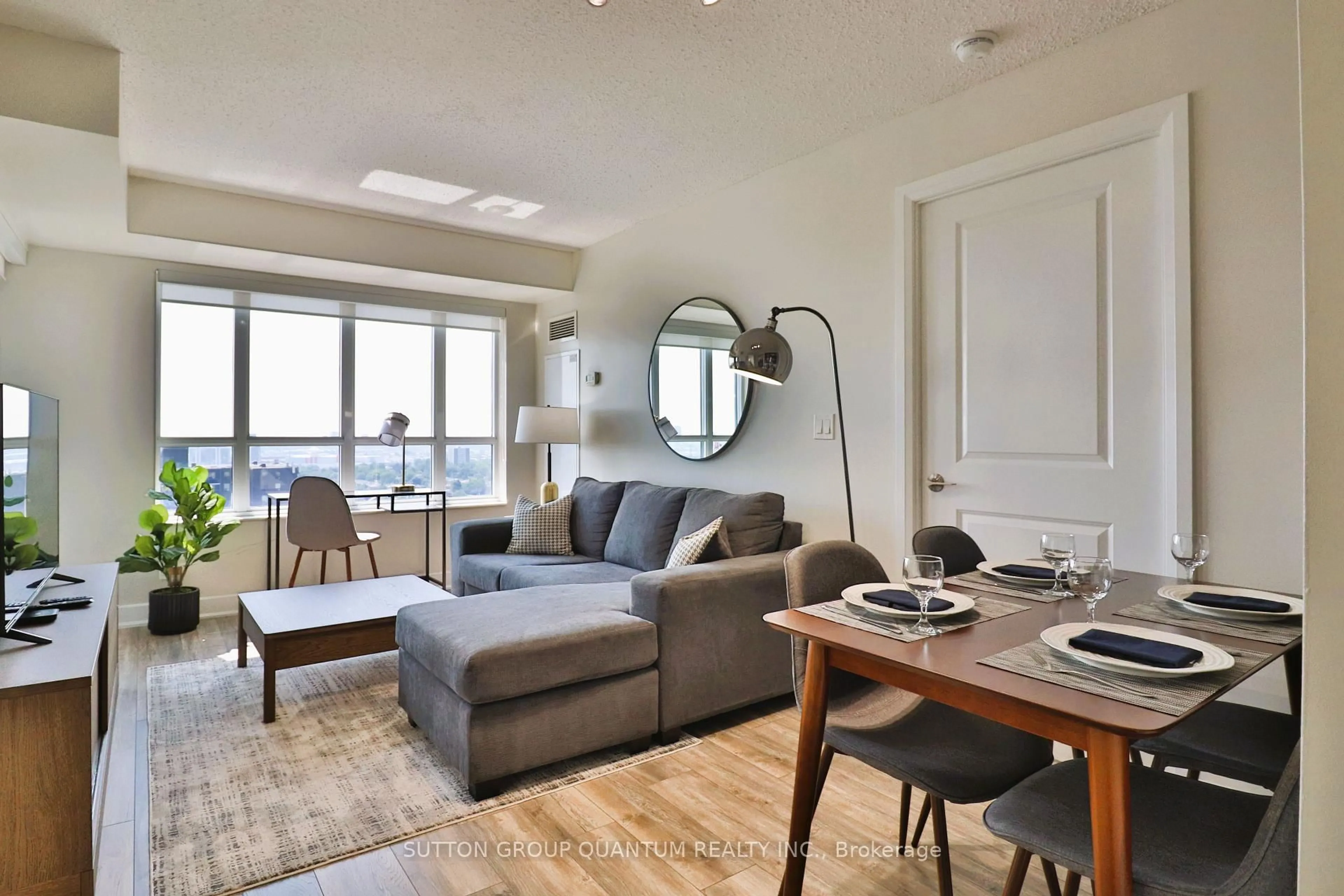 Living room with furniture, wood/laminate floor for 6 Eva Rd #1807, Toronto Ontario M9C 0B1