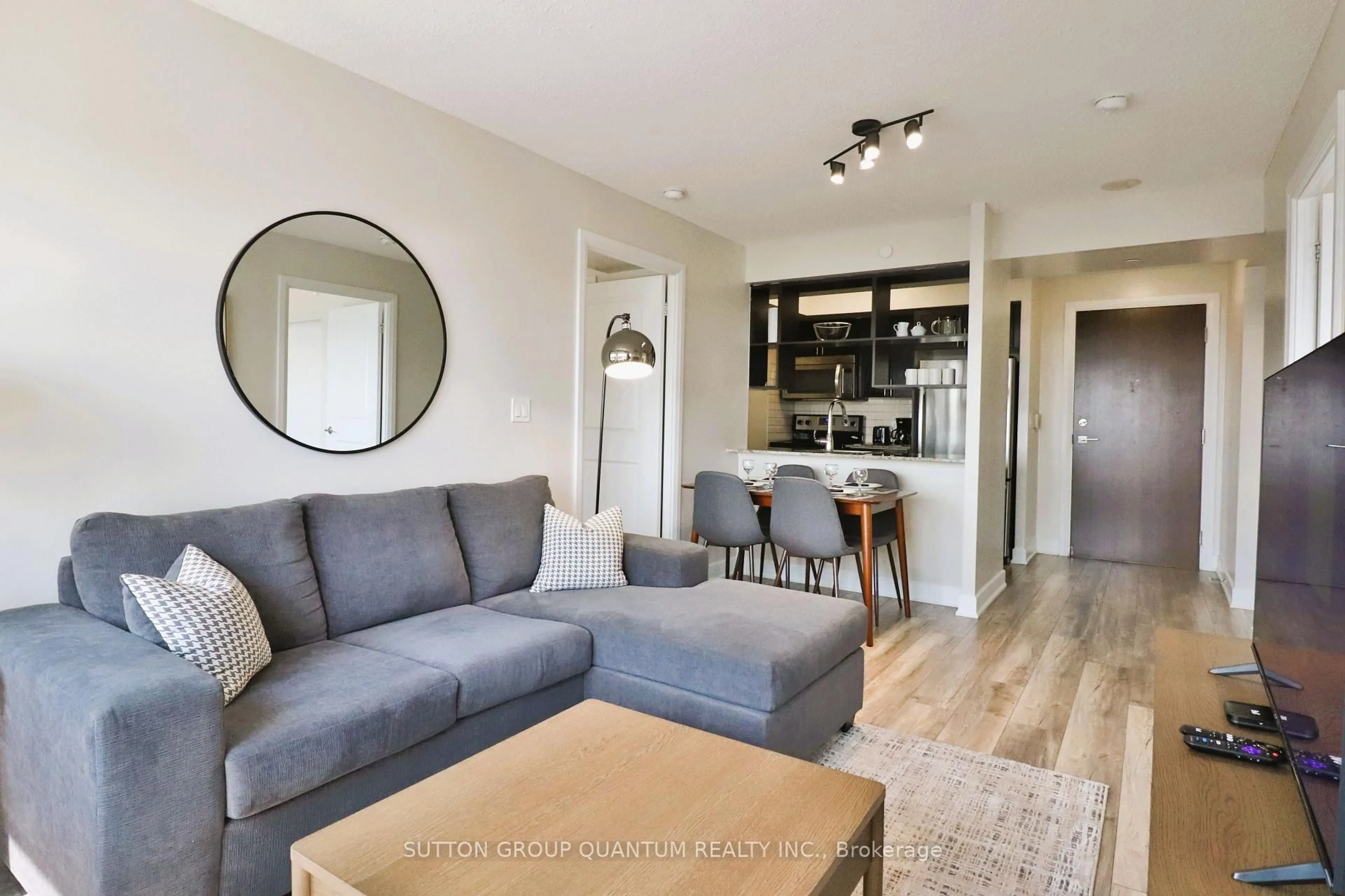 Living room with furniture, wood/laminate floor for 6 Eva Rd #1807, Toronto Ontario M9C 0B1