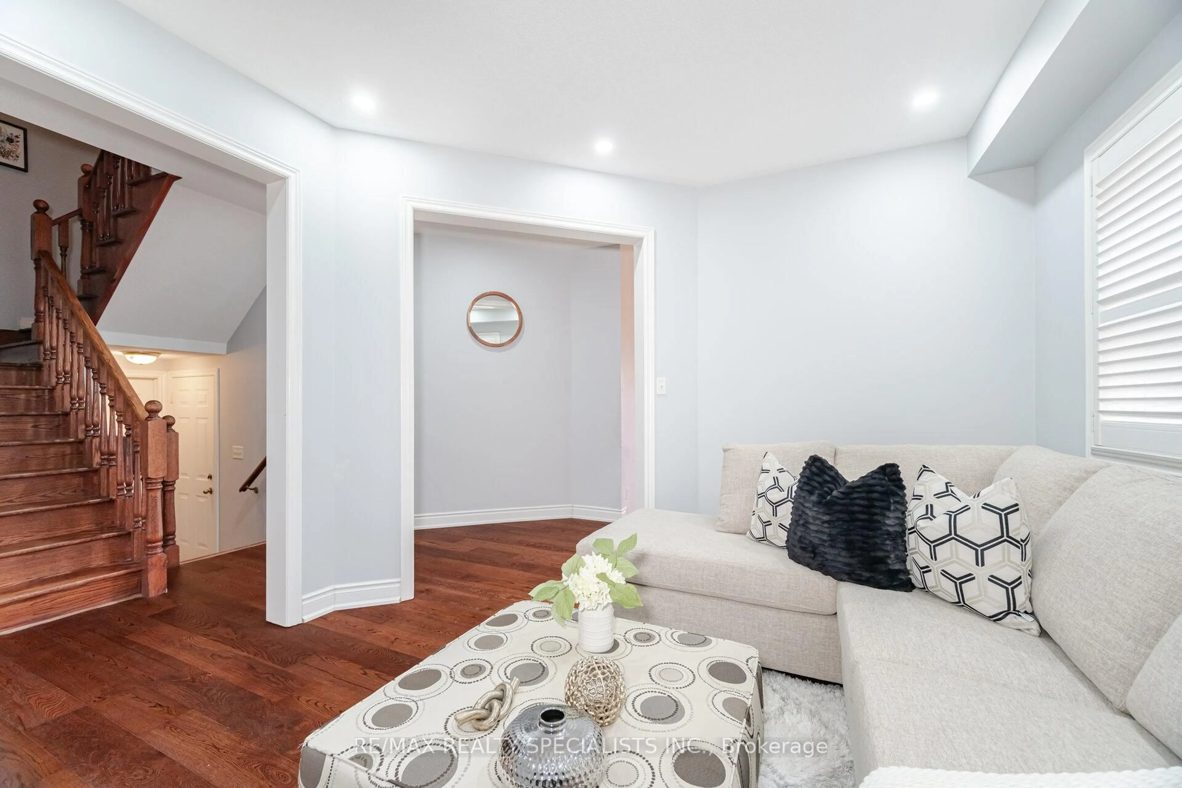 Living room with furniture, wood/laminate floor for 8 Goreridge Cres, Brampton Ontario L6P 1P2