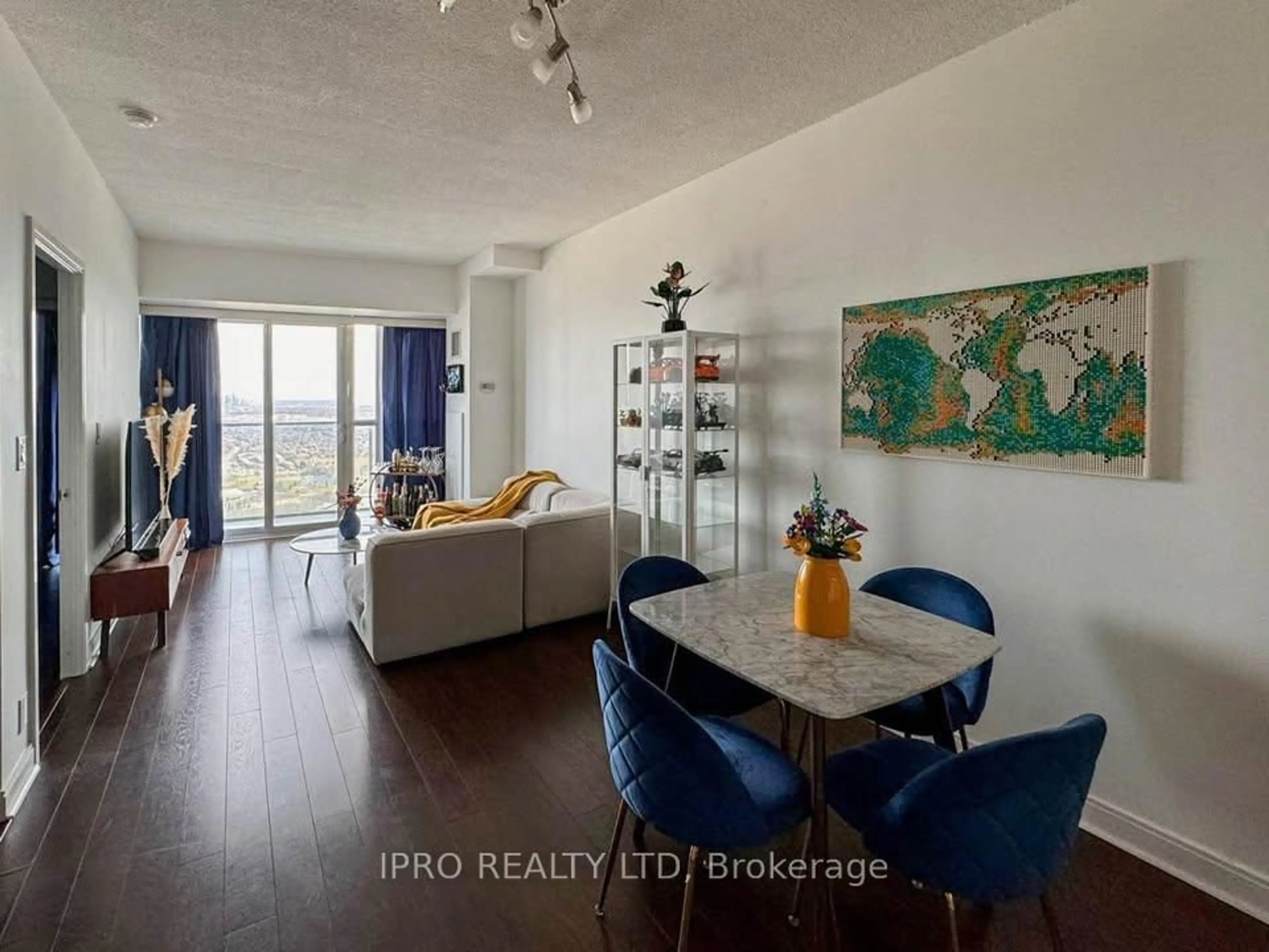 Living room with furniture, wood/laminate floor for 60 Absolute Ave #4101, Mississauga Ontario L4Z 0A9