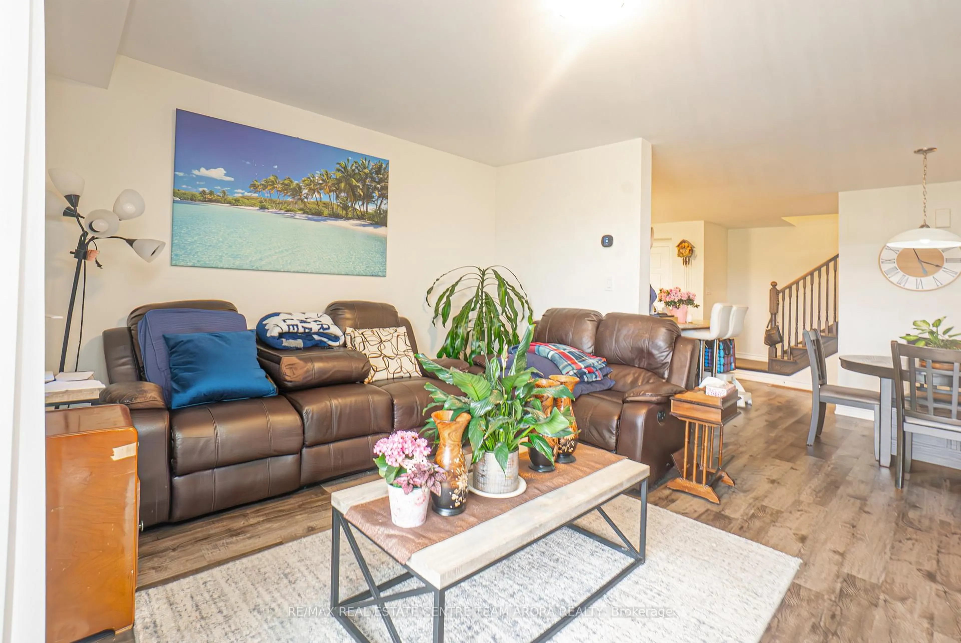 Living room with furniture, wood/laminate floor for 990 Balsam Crt, Milton Ontario L9E 1R5
