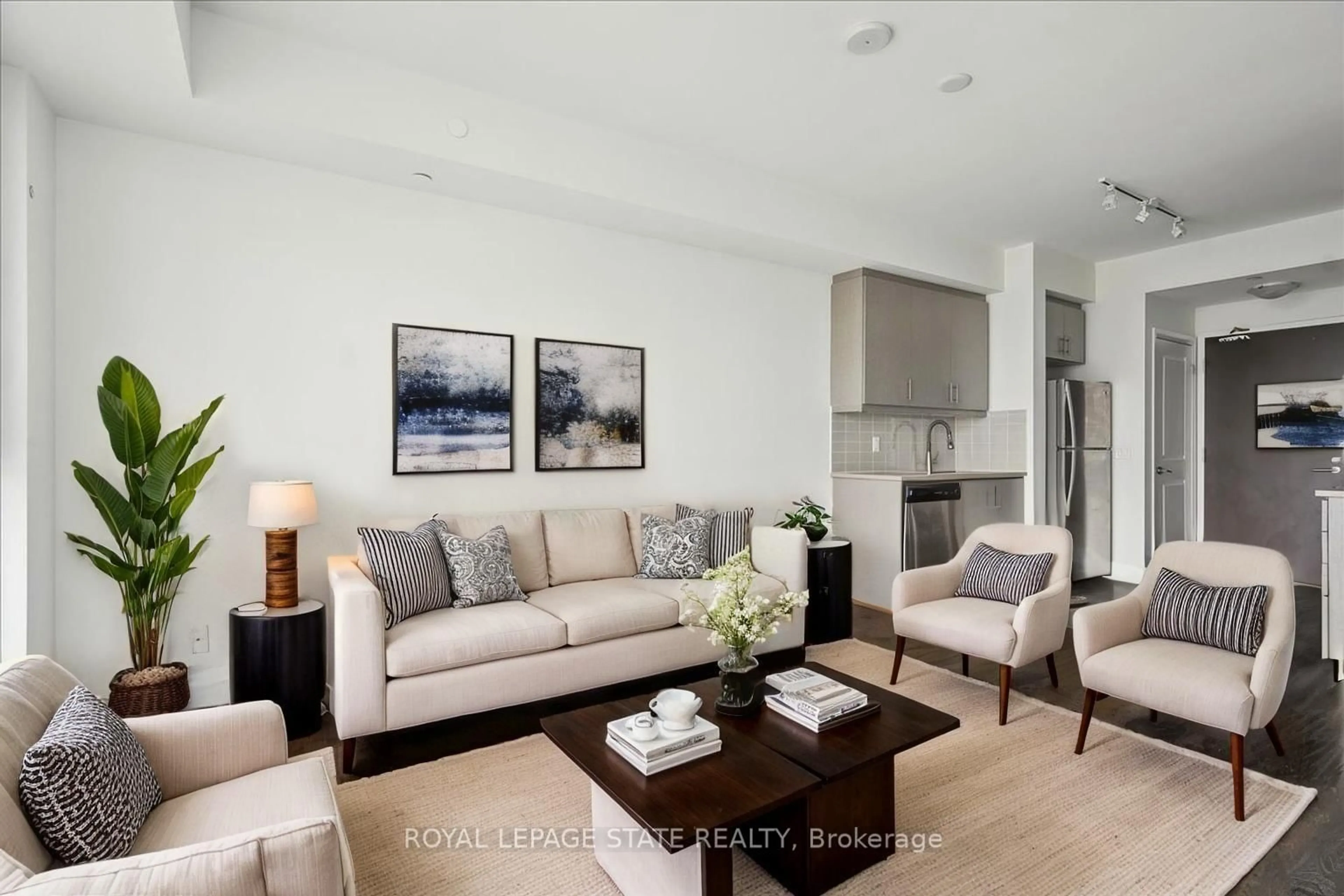 Living room with furniture, wood/laminate floor for 17 Zorra St #2013, Toronto Ontario M8Z 4Z6