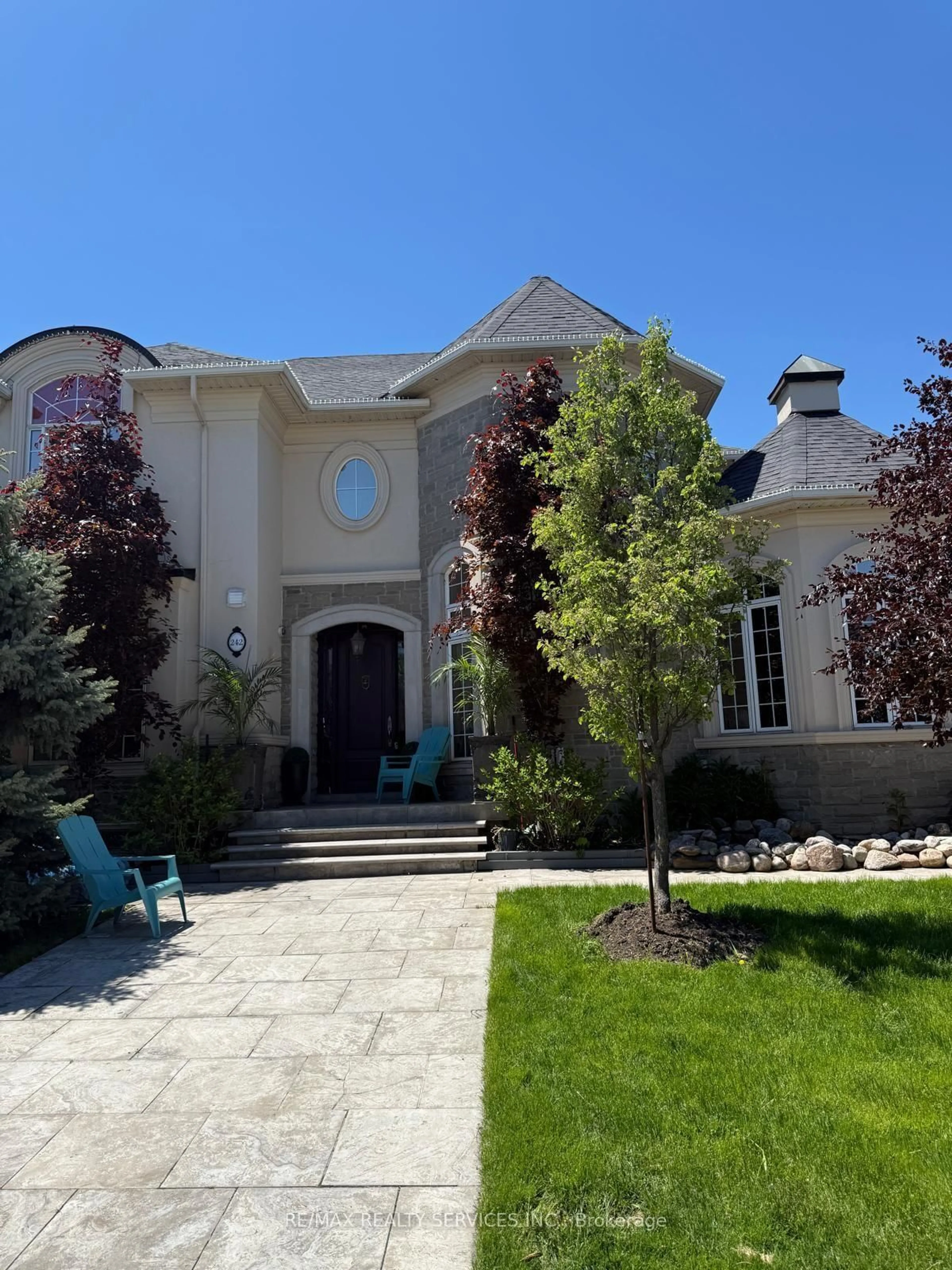 Home with brick exterior material, street for 242 Milkweed Way, Oakville Ontario L6L 0A6